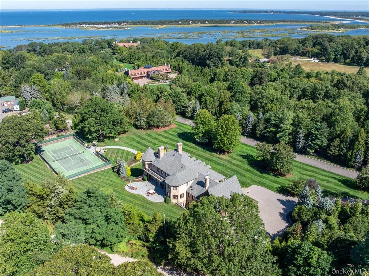 View of property location with a nearby body of water and a tree filled landscape View of property location with a nearby body of water and a tree filled landscape