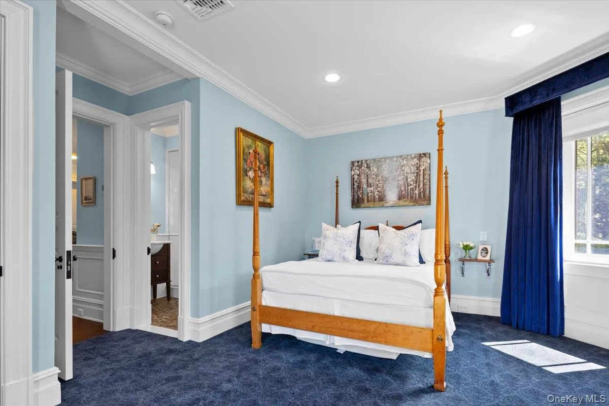 Carpeted bedroom featuring ornamental molding and recessed lighting Carpeted bedroom featuring ornamental molding and recessed lighting