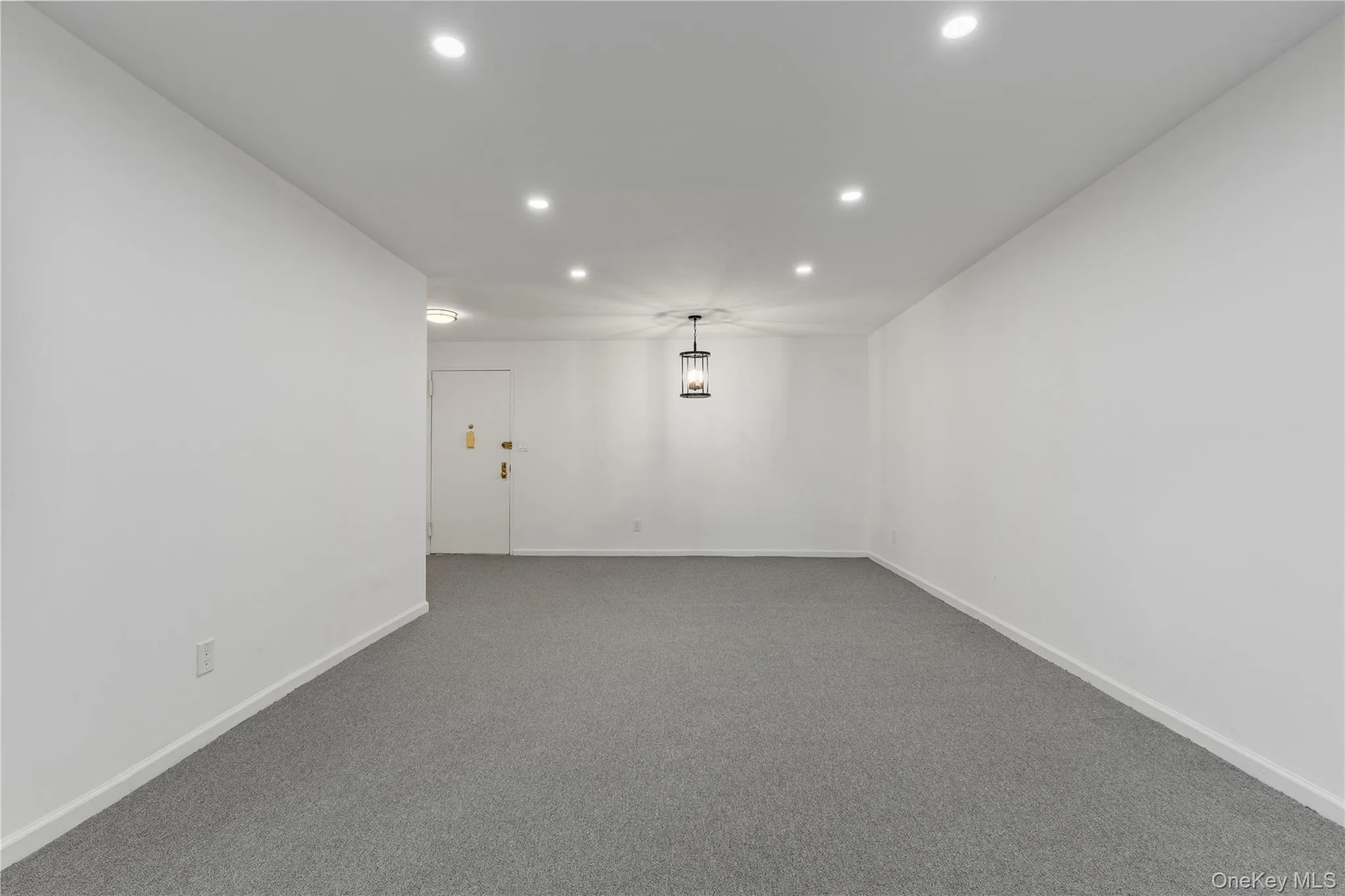 Unfurnished room featuring recessed lighting and carpet flooring Unfurnished room featuring recessed lighting and carpet flooring