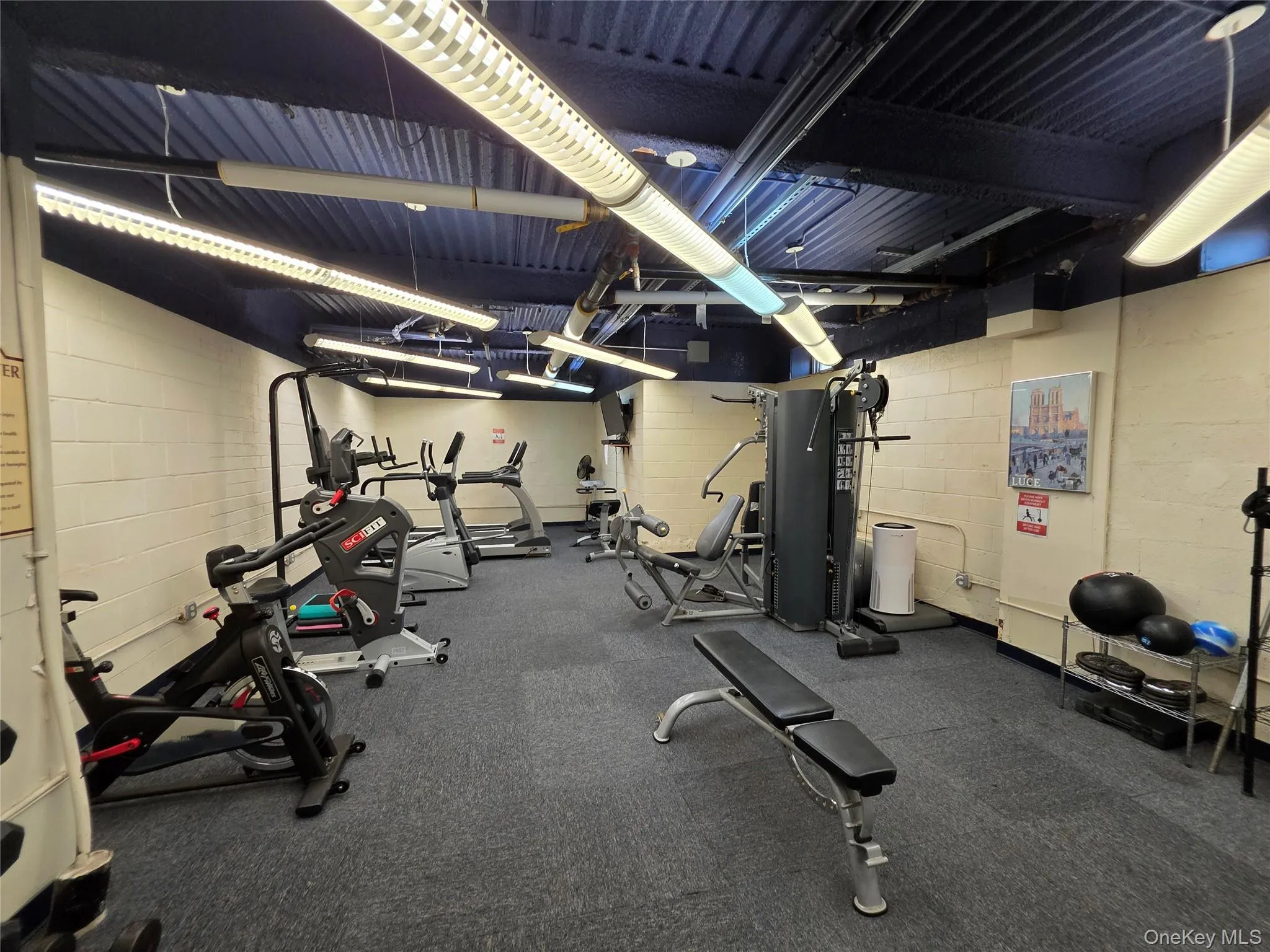 Gym featuring concrete block wall Gym featuring concrete block wall