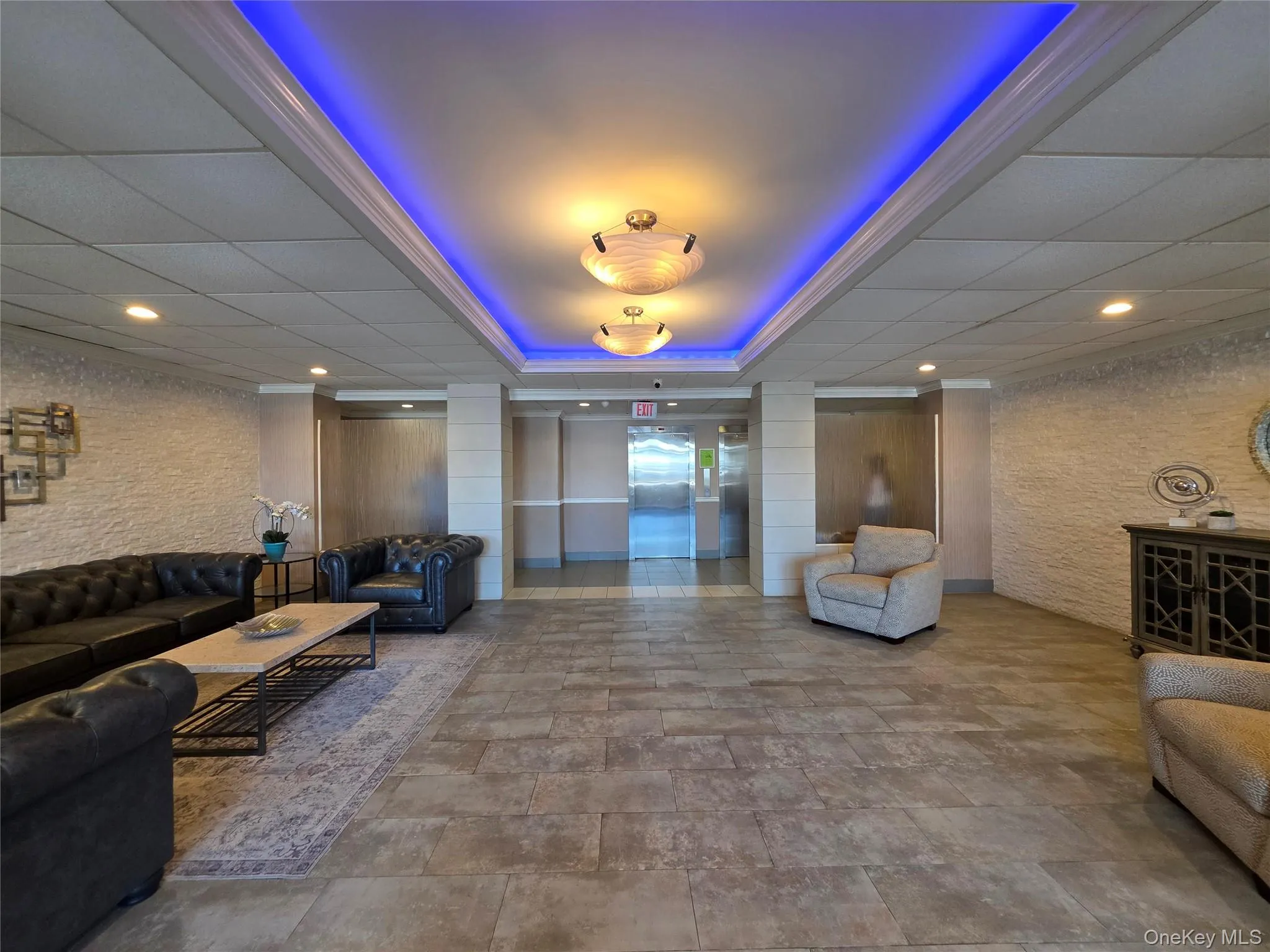 Common area featuring recessed lighting and a drop ceiling Common area featuring recessed lighting and a drop ceiling