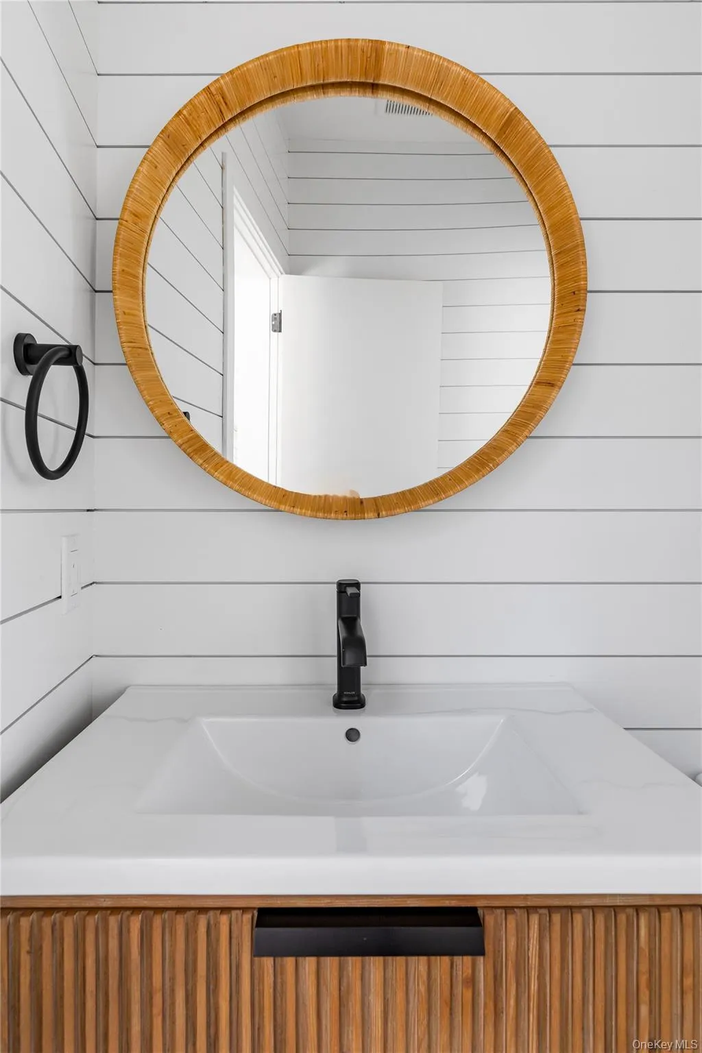 Bathroom with vanity and wooden walls Bathroom with vanity and wooden walls