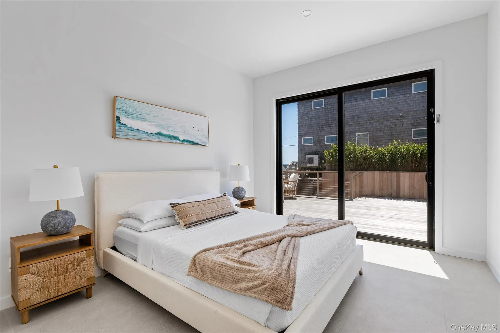 Bedroom with baseboards and access to outside Bedroom with baseboards and access to outside