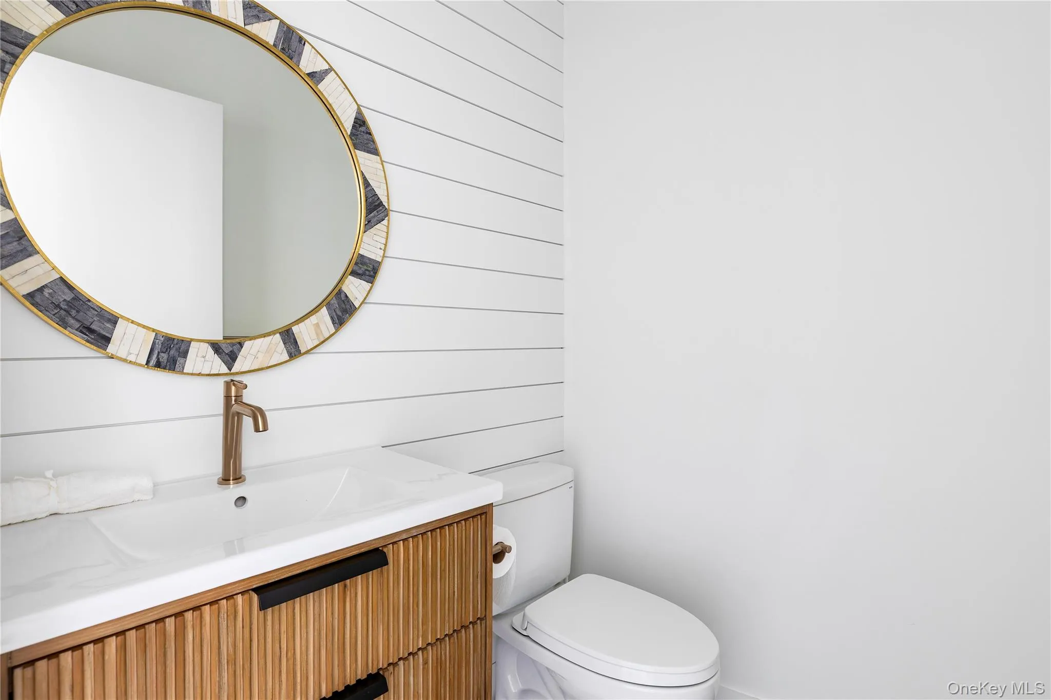 Half bathroom with vanity and toilet Half bathroom with vanity and toilet