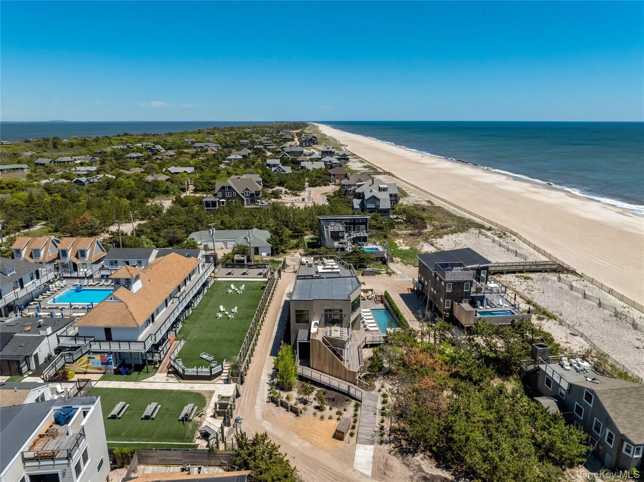 Drone / aerial view of unending shoreline and a pool area Drone / aerial view of unending shoreline and a pool area