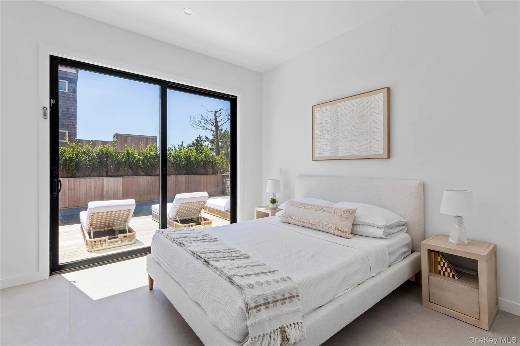 Bedroom featuring access to outside and light tile patterned floors Bedroom featuring access to outside and light tile patterned floors
