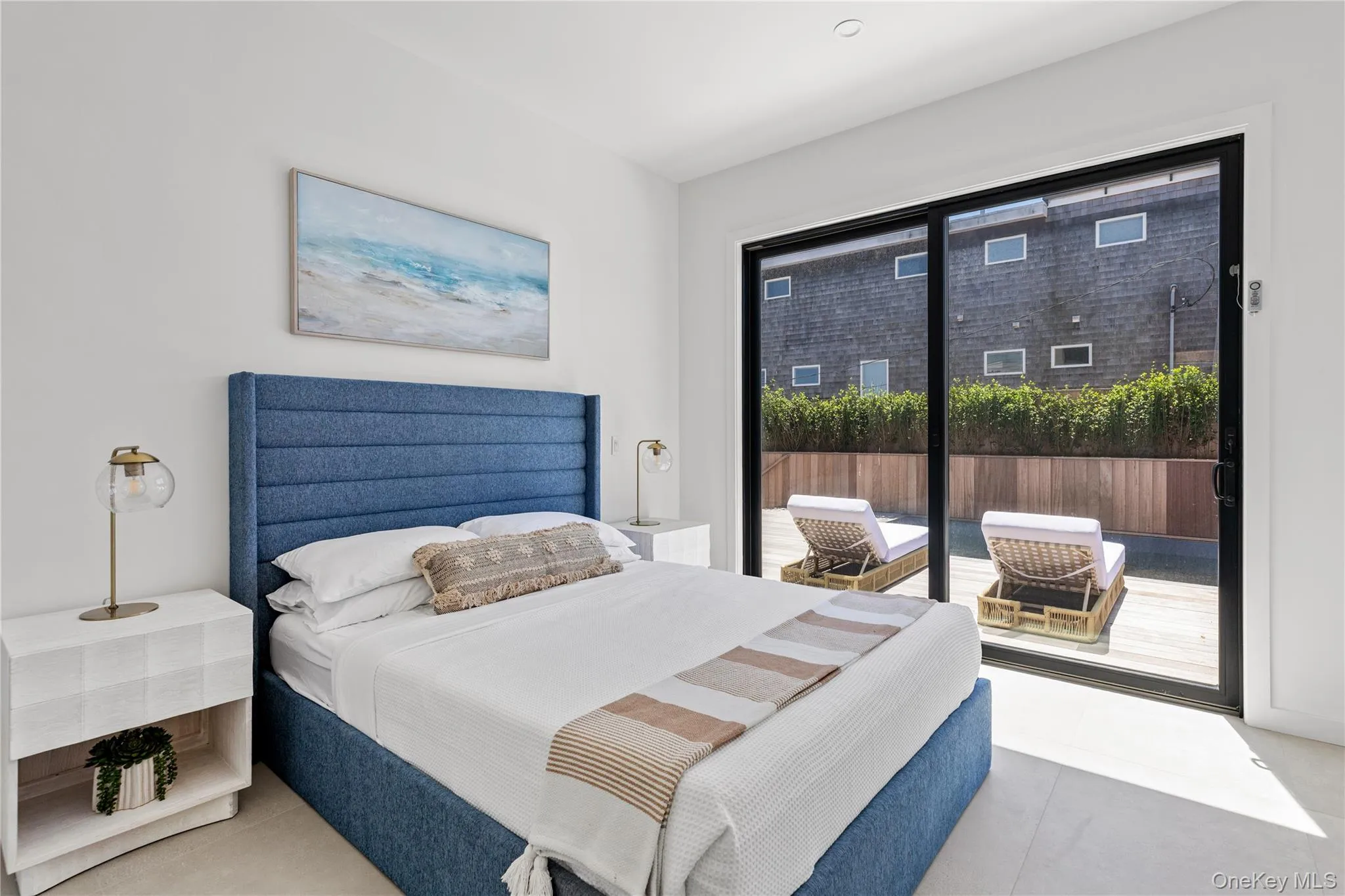 Bedroom featuring access to exterior and tile patterned flooring Bedroom featuring access to exterior and tile patterned flooring