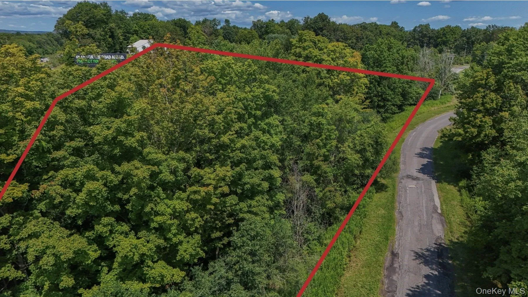 Aerial view of property from the other end of Midland Lake Road with estimated parcel lines outlined Aerial view of property from the other end of Midland Lake Road with estimated parcel lines outlined