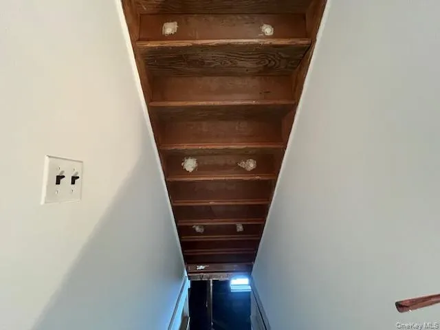 Stairway featuring baseboards Stairway featuring baseboards