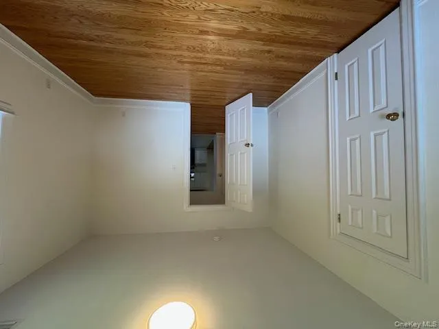 Unfurnished bedroom with light wood finished floors and baseboards Unfurnished bedroom with light wood finished floors and baseboards