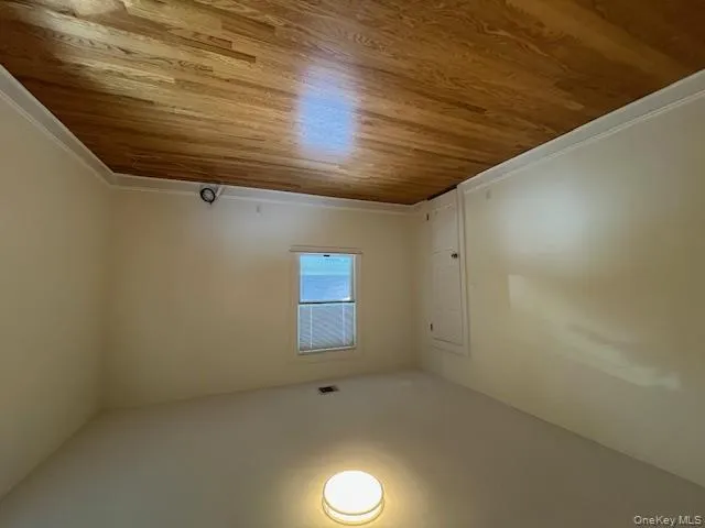 Unfurnished room featuring light wood-style flooring and baseboards Unfurnished room featuring light wood-style flooring and baseboards