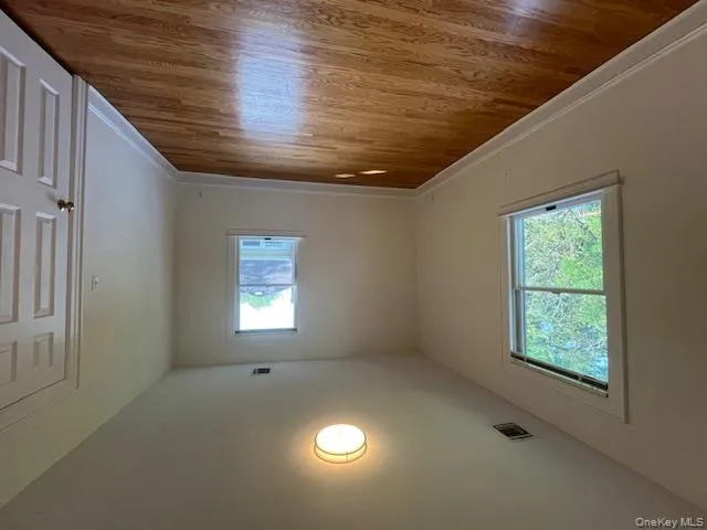 Unfurnished room featuring light wood-style floors and baseboards Unfurnished room featuring light wood-style floors and baseboards
