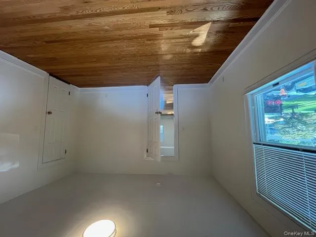 Spare room featuring light wood finished floors and baseboards Spare room featuring light wood finished floors and baseboards