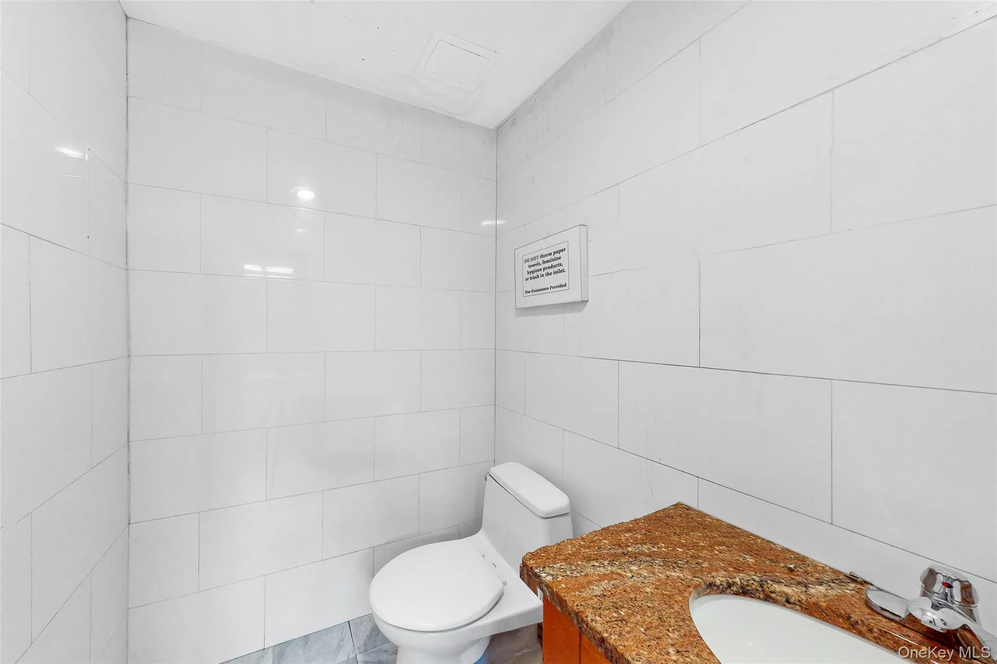 Bathroom with tile walls and vanity Bathroom with tile walls and vanity