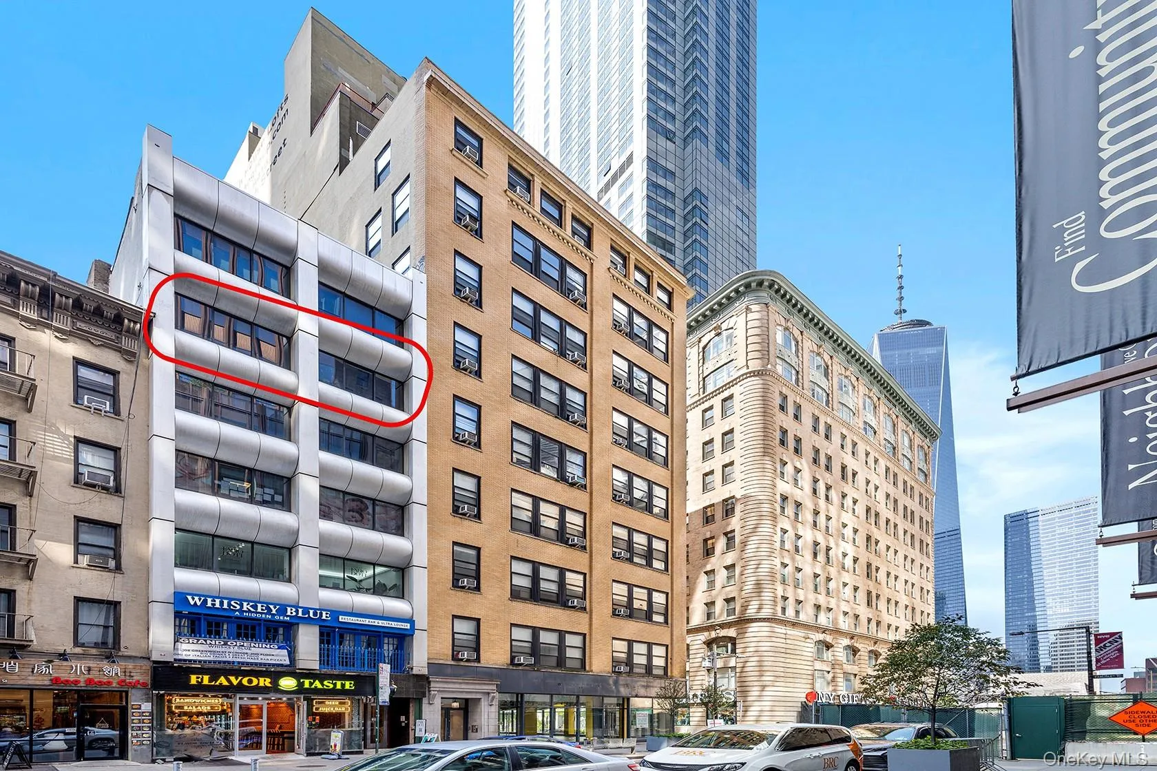 View of building exterior featuring a city view View of building exterior featuring a city view