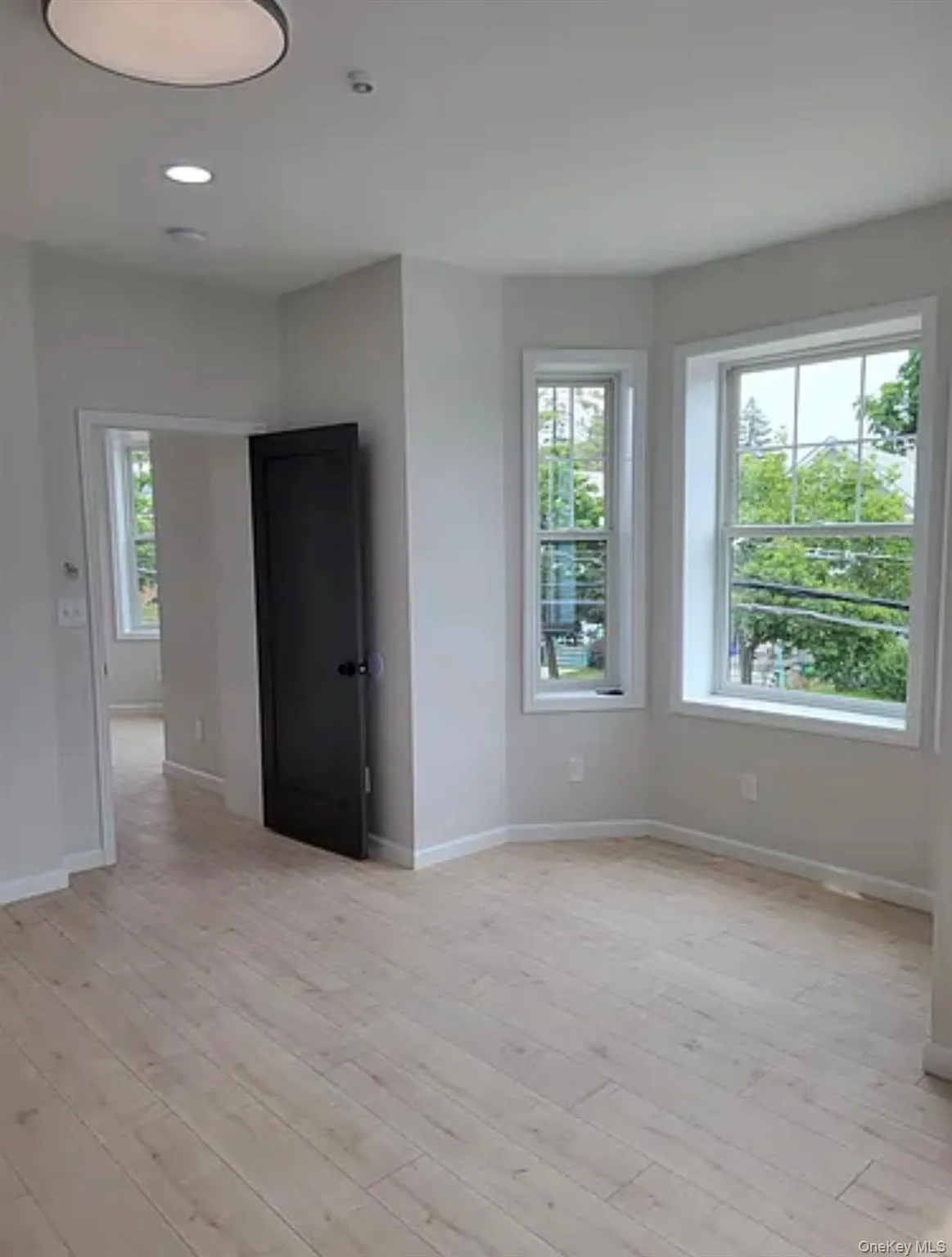 Empty room featuring light wood-style floors and recessed lighting Empty room featuring light wood-style floors and recessed lighting
