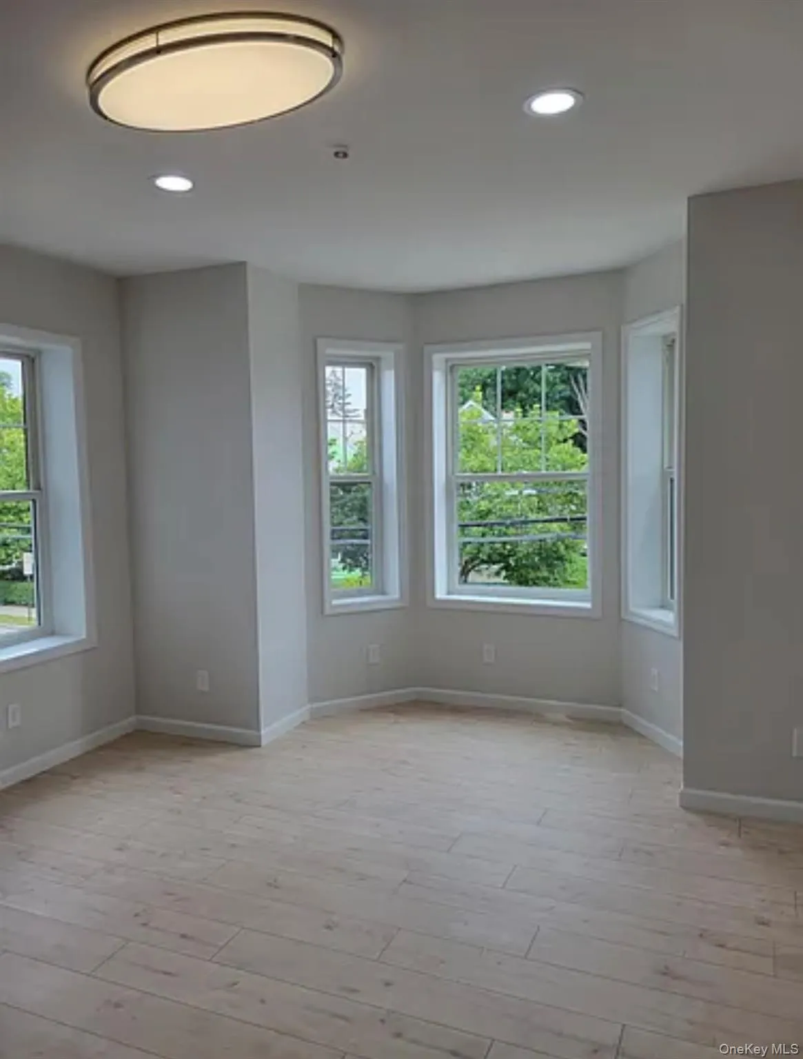 Spare room with recessed lighting and light wood-style floors Spare room with recessed lighting and light wood-style floors