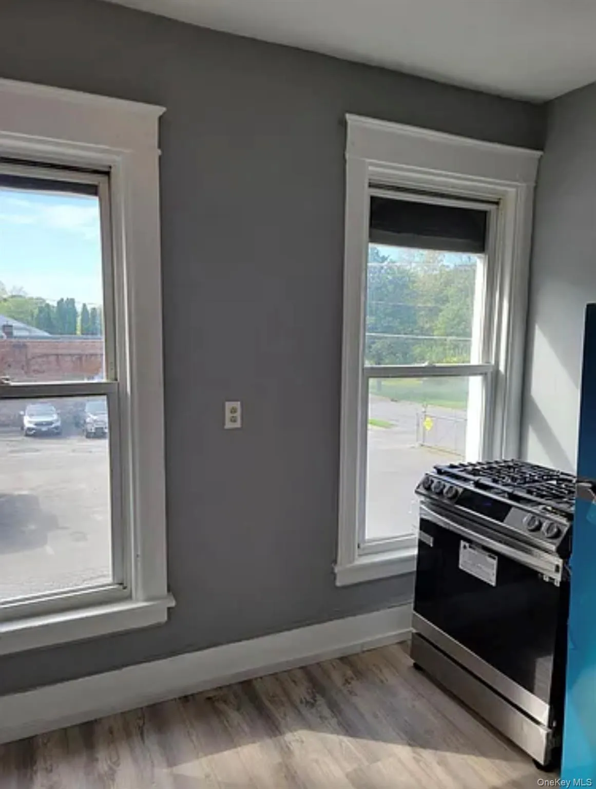 Kitchen featuring stainless steel range with gas cooktop and light wood-type flooring Kitchen featuring stainless steel range with gas cooktop and light wood-type flooring