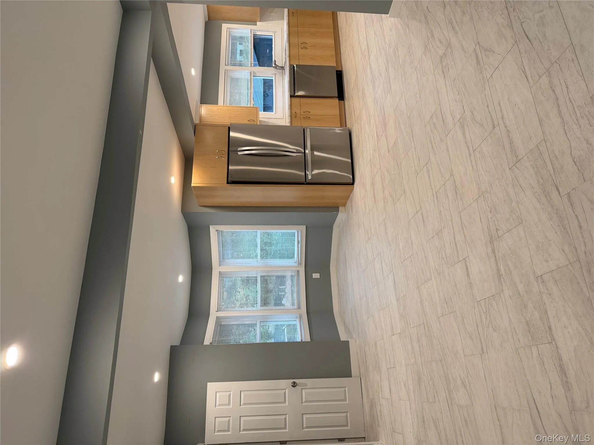 Kitchen featuring refrigerator, recessed lighting, light countertops, dishwasher, and healthy amount of natural light Kitchen featuring refrigerator, recessed lighting, light countertops, dishwasher, and healthy amount of natural light