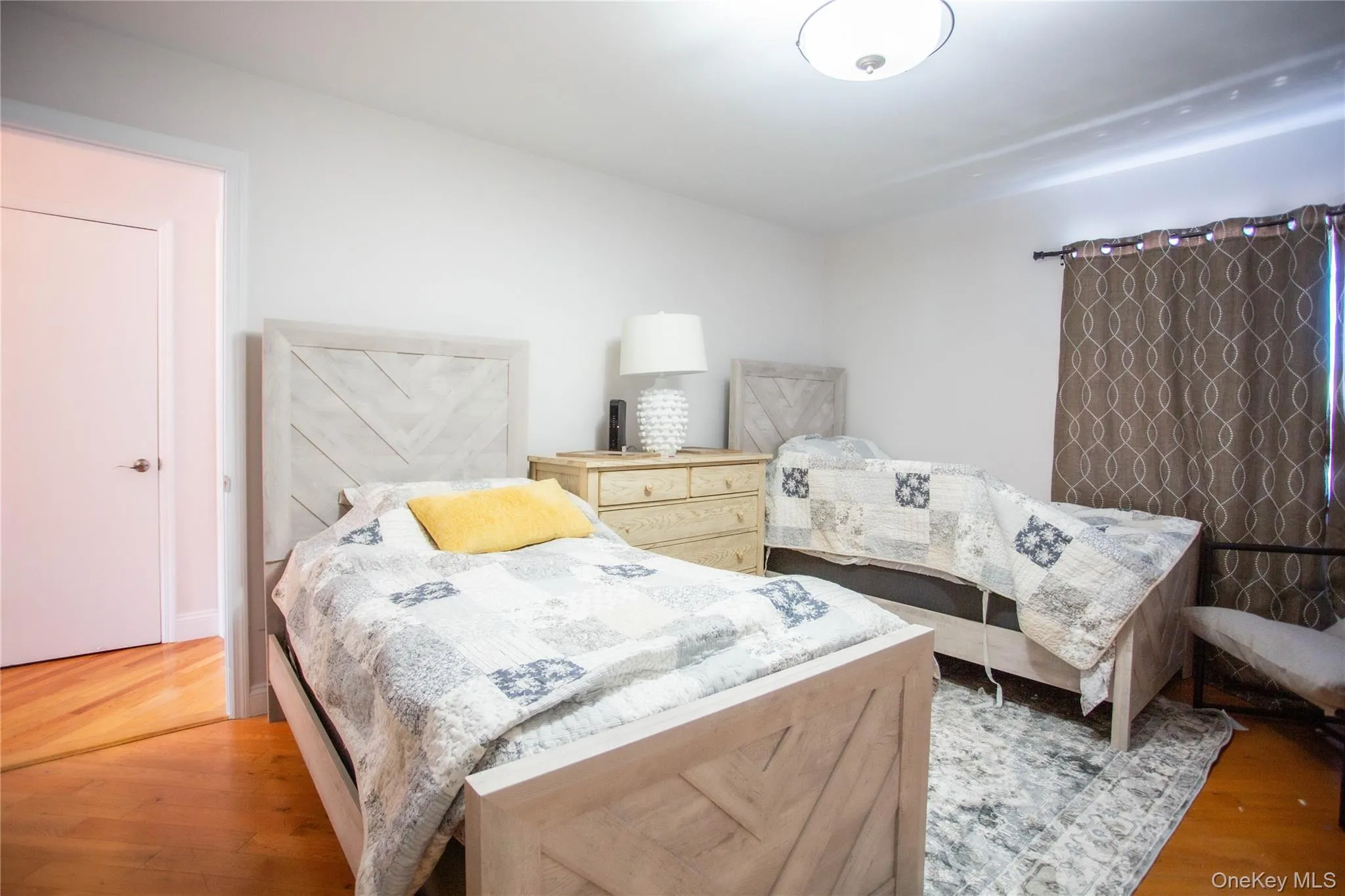 Bedroom featuring wood finished floors Bedroom featuring wood finished floors