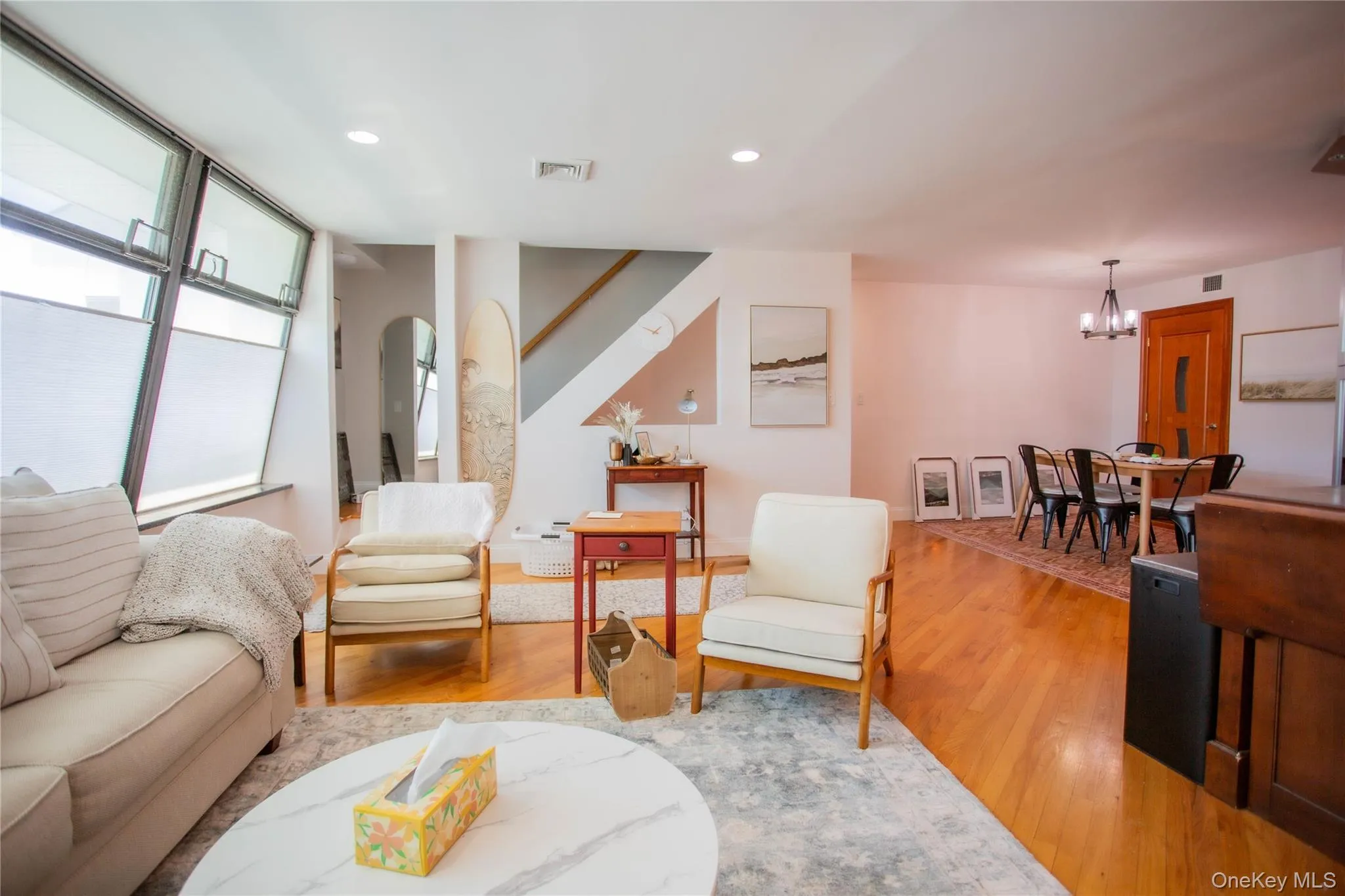 Sitting room with light wood-style flooring, recessed lighting, and a chandelier Sitting room with light wood-style flooring, recessed lighting, and a chandelier