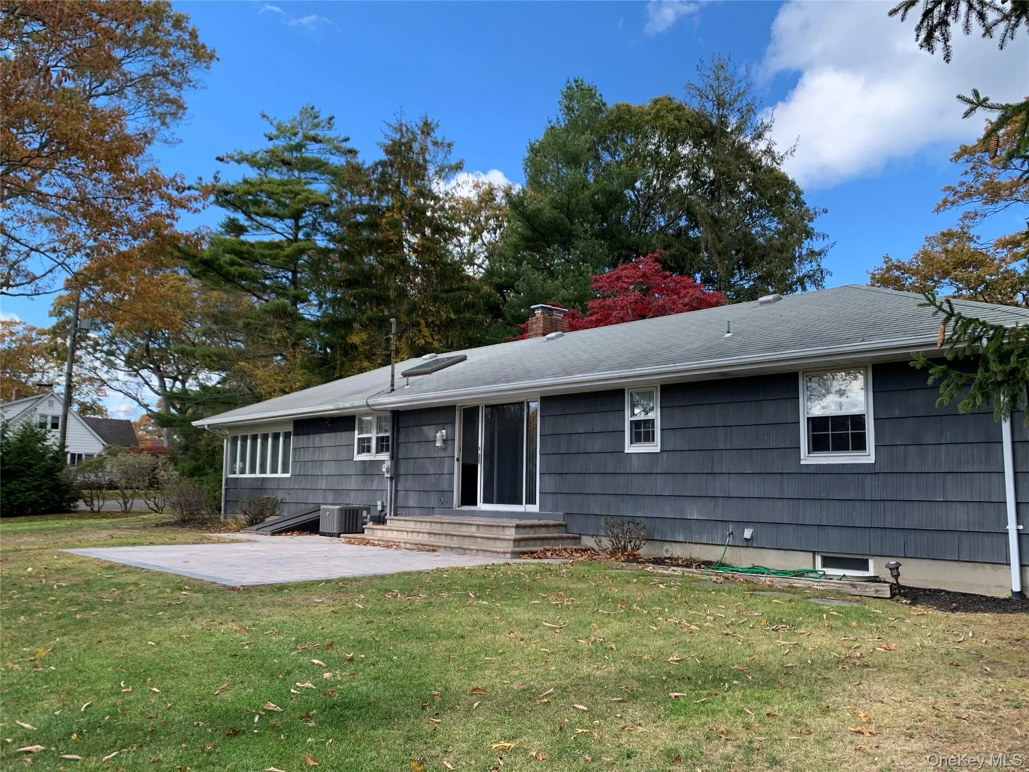 Sun dappled rear patio and yard. Sun dappled rear patio and yard.