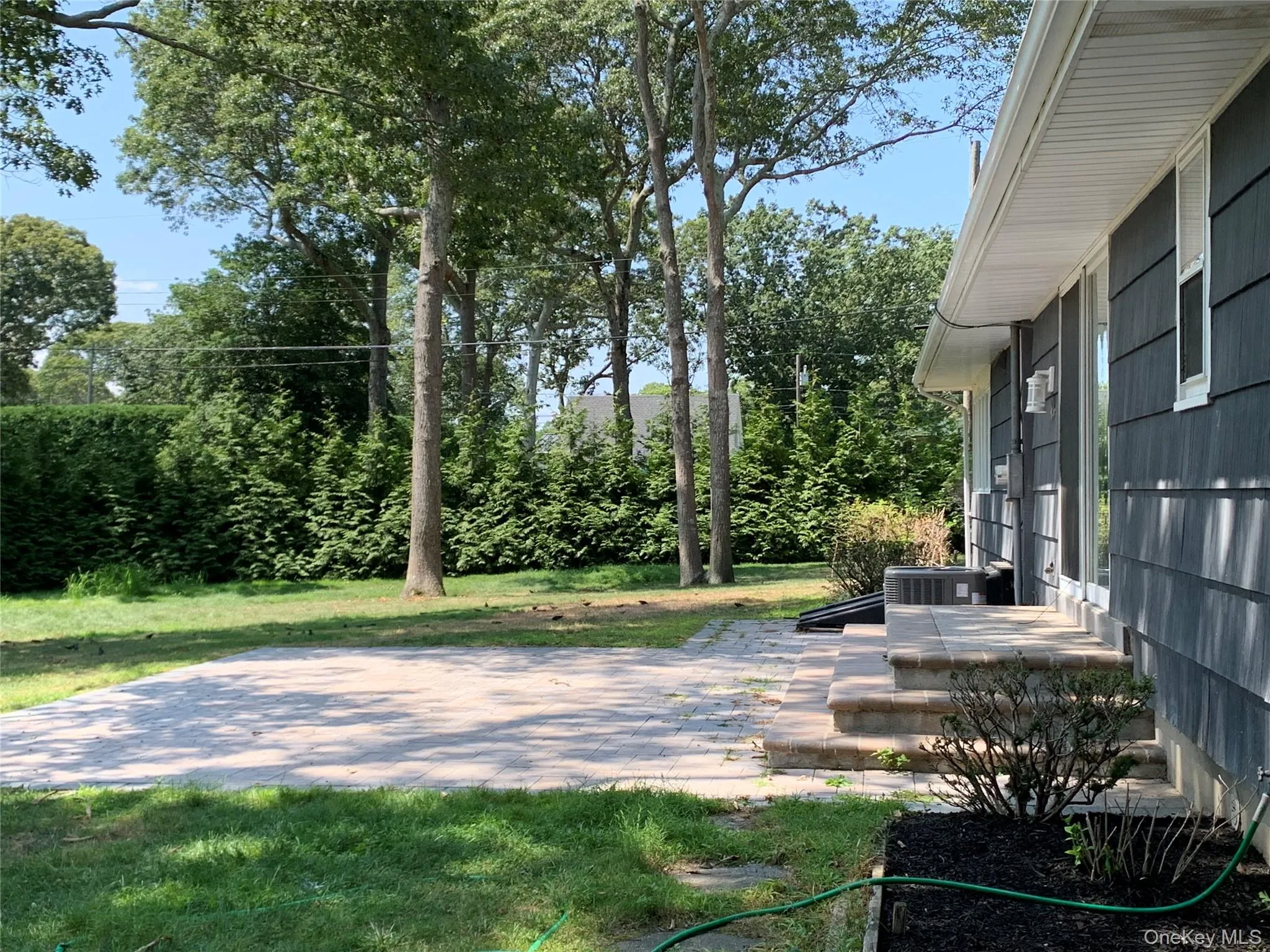 paver patio off dining room. paver patio off dining room.