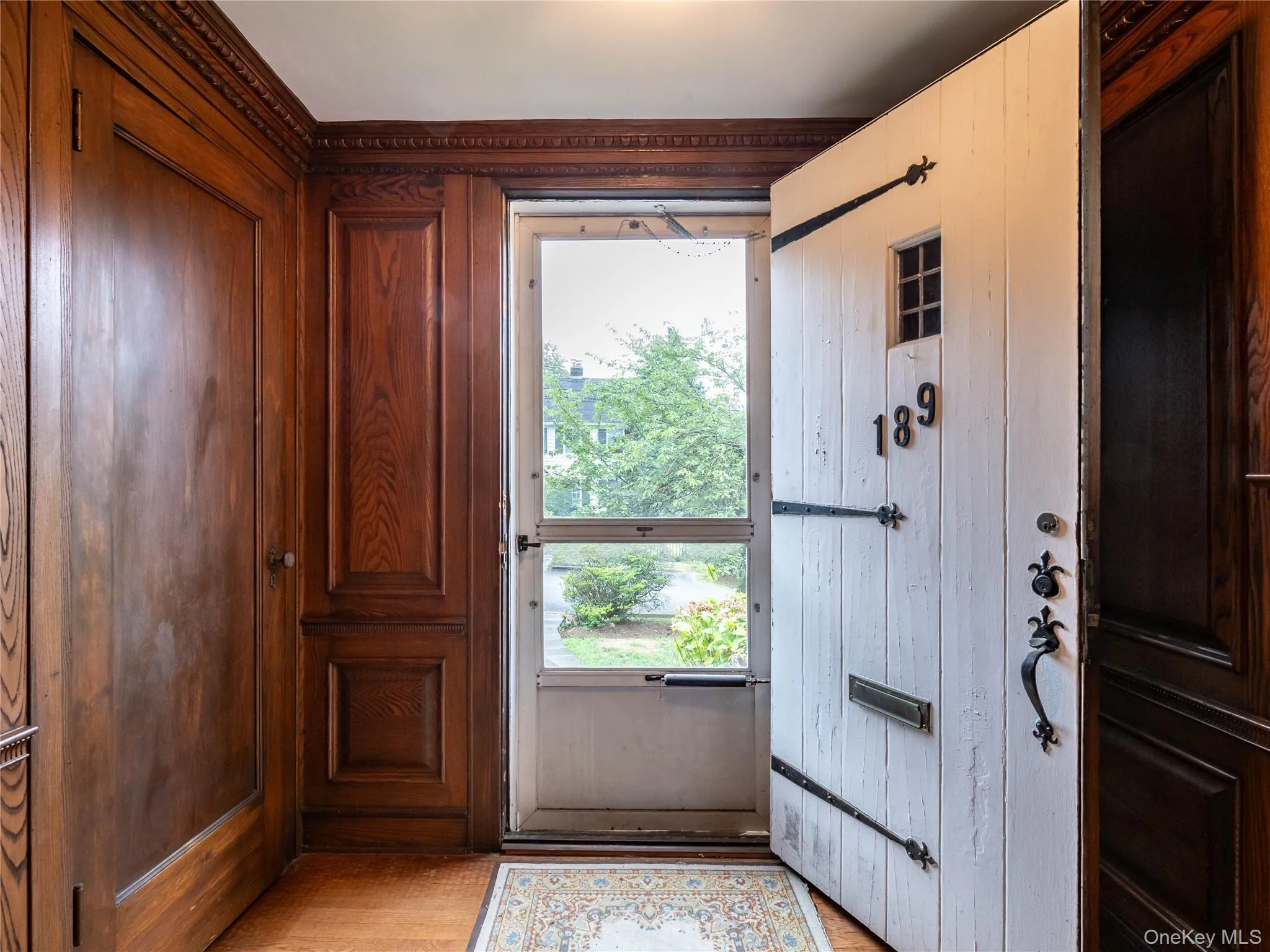 Entryway with wooden walls and wood finished floors Entryway with wooden walls and wood finished floors
