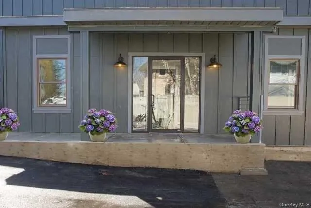View of exterior entry with board and batten siding View of exterior entry with board and batten siding