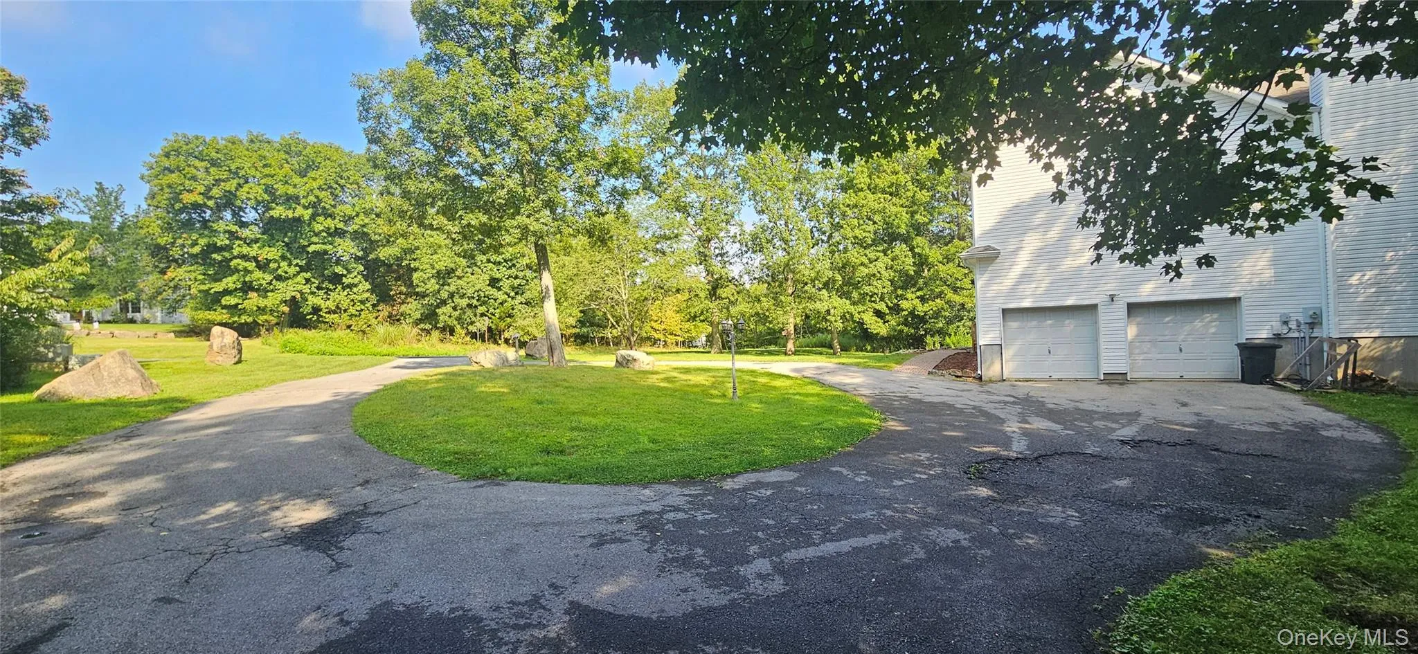 Large driveway with turnaround. Plenty of parking with additional bonus spot out of the way. Large driveway with turnaround. Plenty of parking with additional bonus spot out of the way.