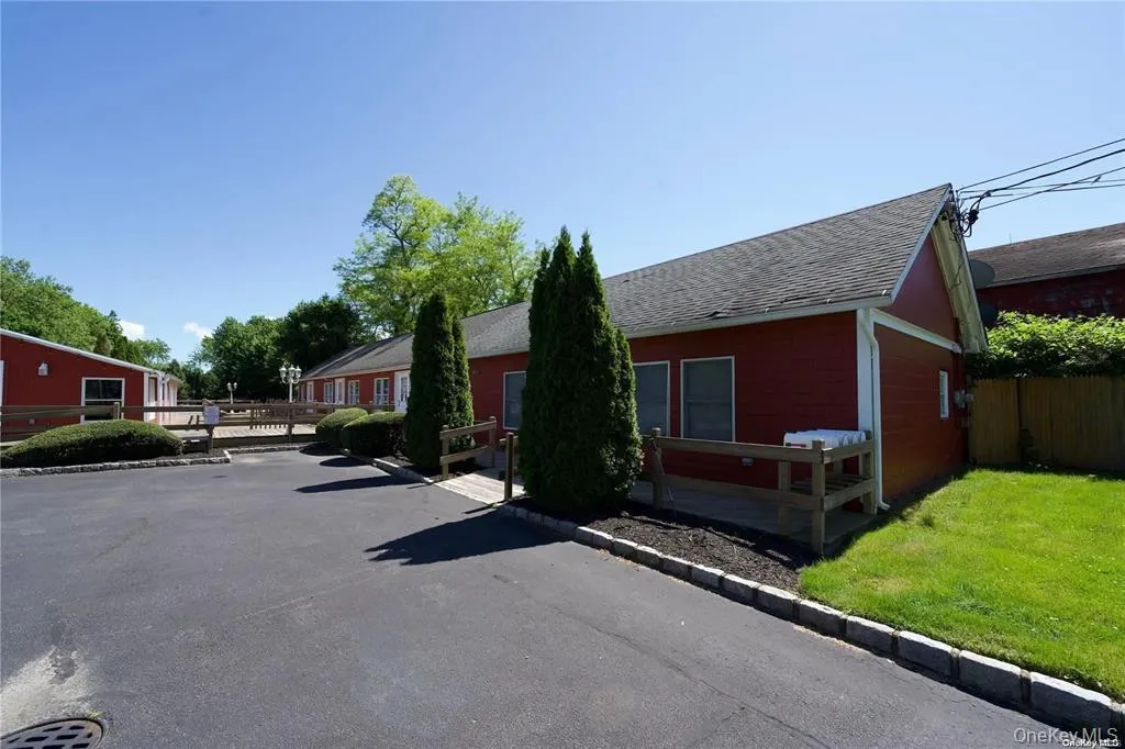 View of front of property featuring a shingled roof View of front of property featuring a shingled roof