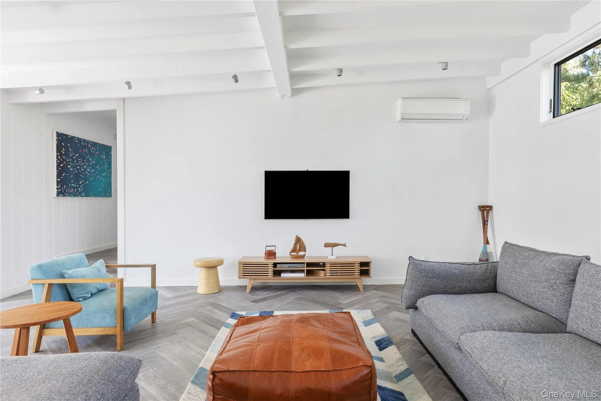 Living area with beam ceiling and a wall mounted AC Living area with beam ceiling and a wall mounted AC