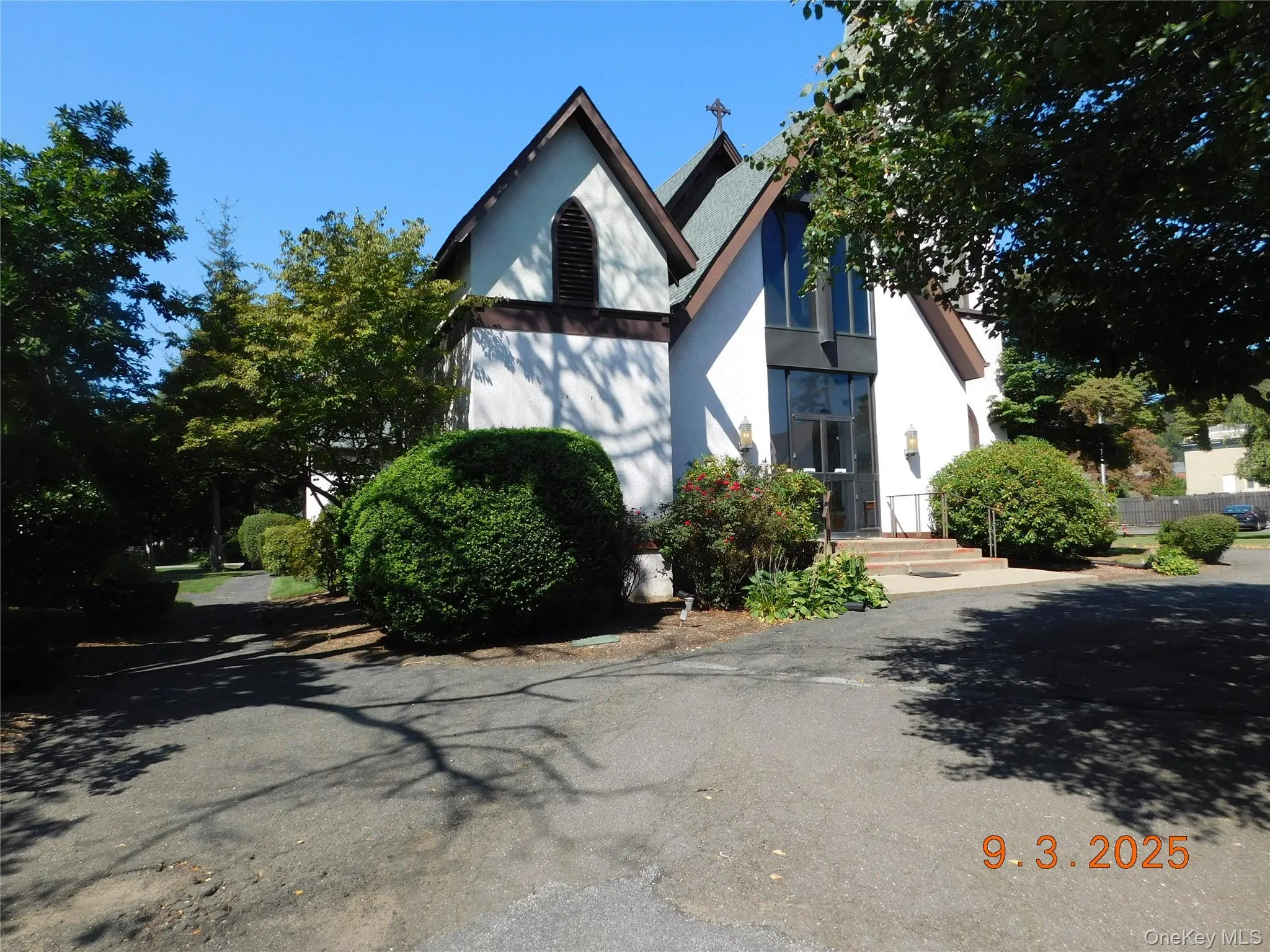 View of front of home featuring stucco siding View of front of home featuring stucco siding