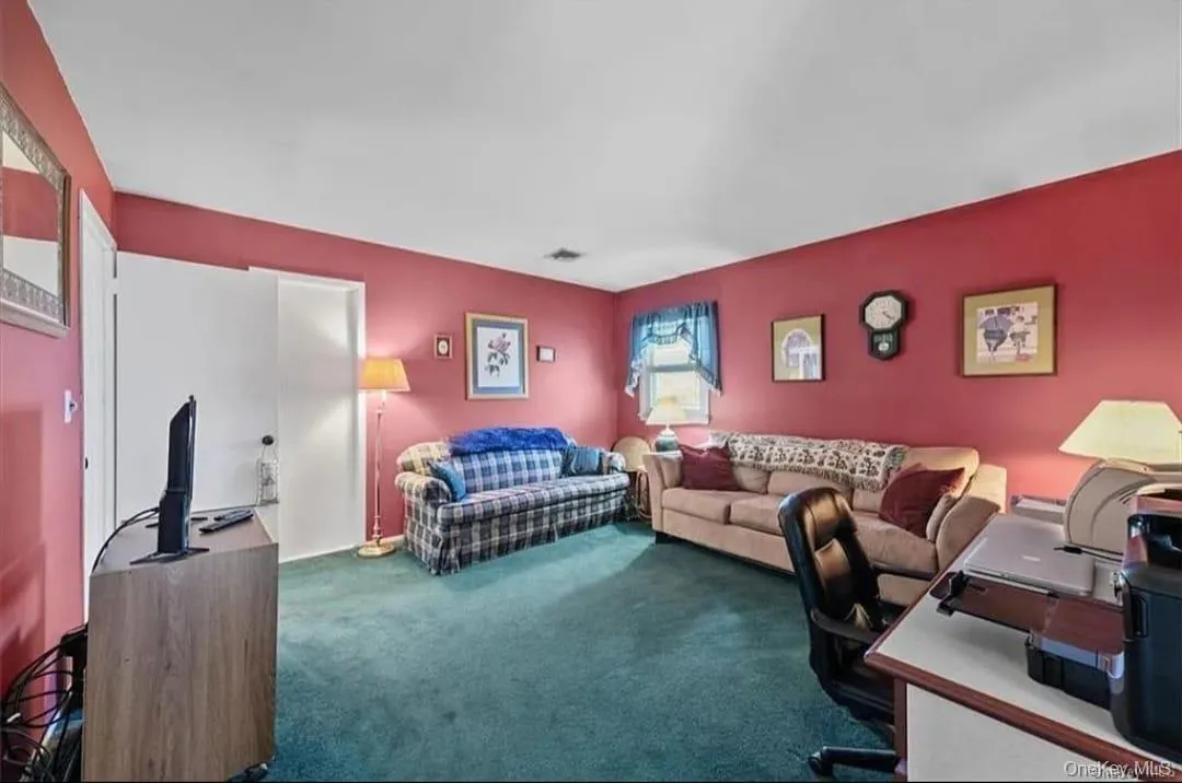 Office area featuring dark colored carpet Office area featuring dark colored carpet