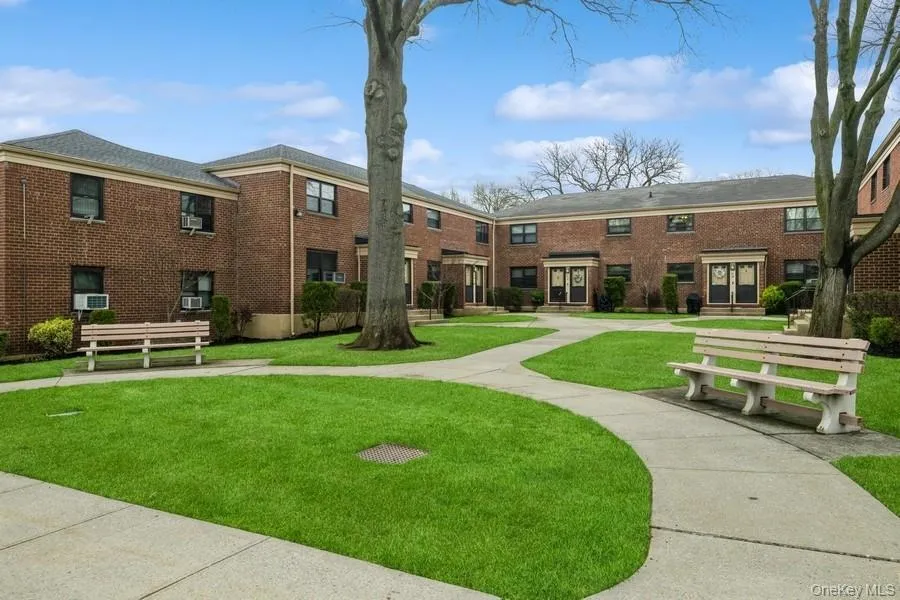 View of property's community featuring a yard View of property's community featuring a yard