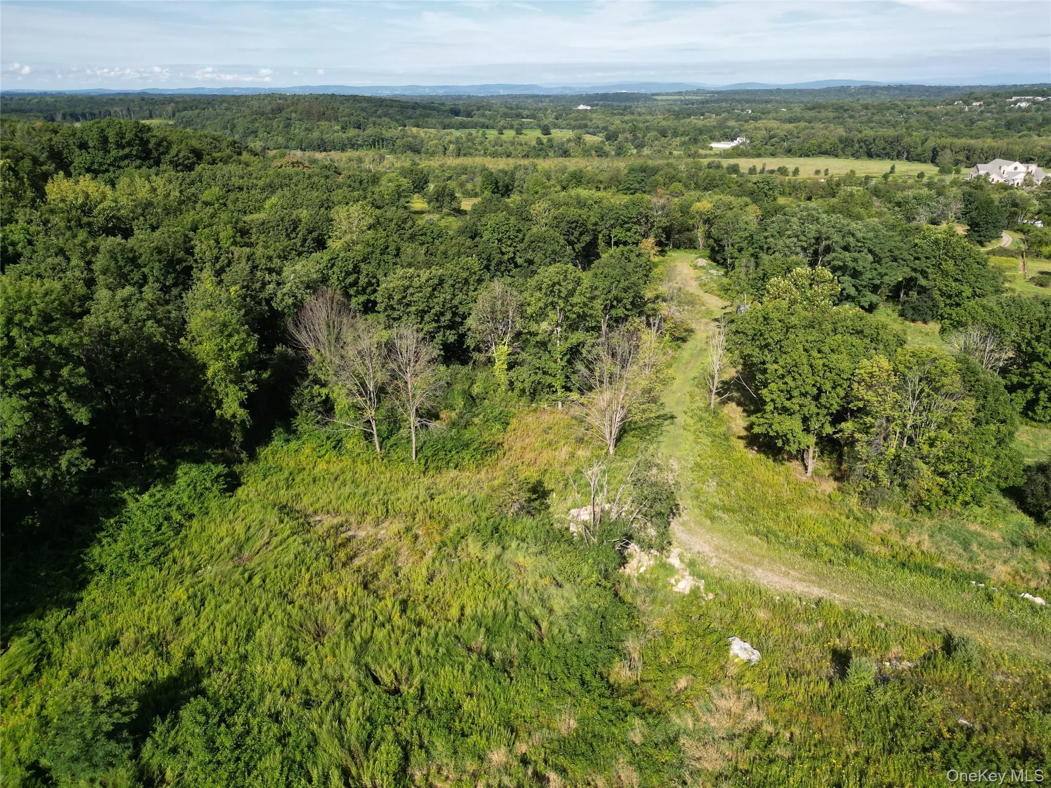 Aerial overview of property's location with a heavily wooded area Aerial overview of property's location with a heavily wooded area