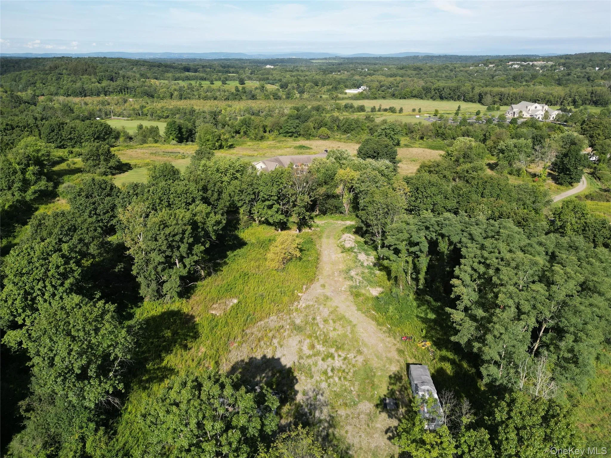 View of property location featuring a forest View of property location featuring a forest