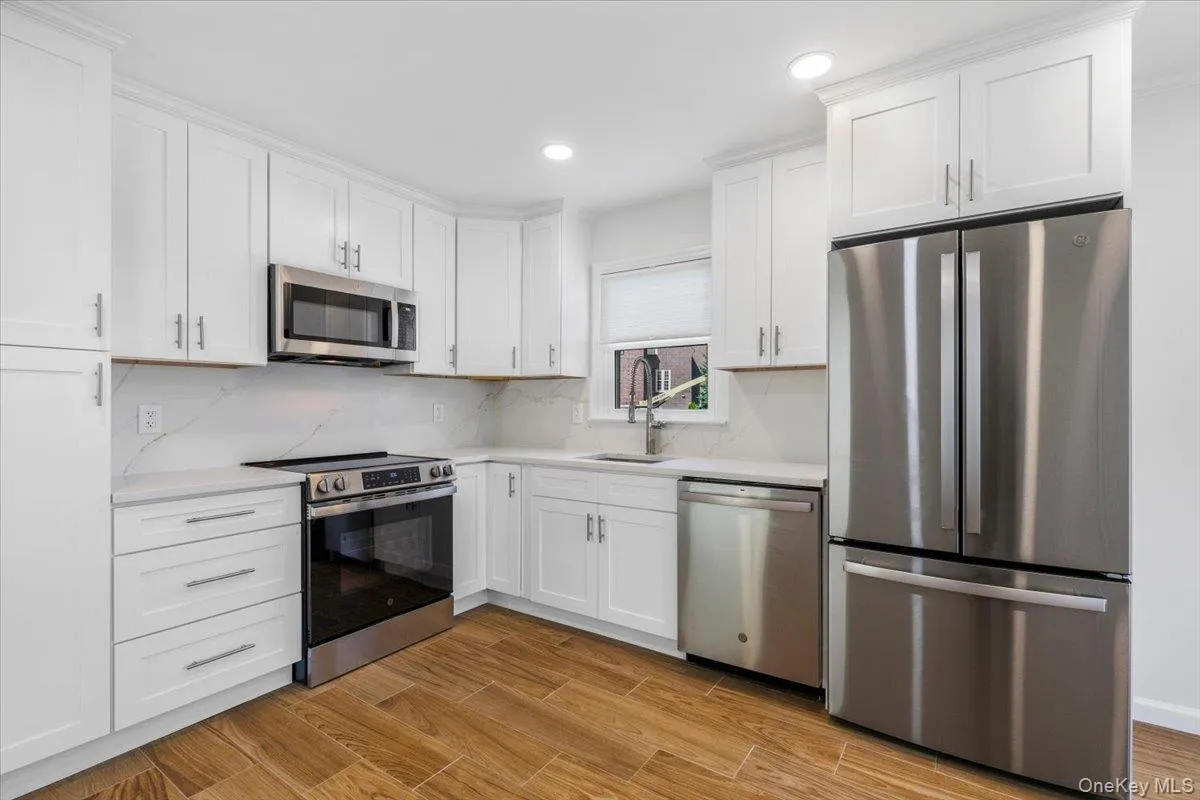Kitchen cabinetry and appliance view. Kitchen cabinetry and appliance view.