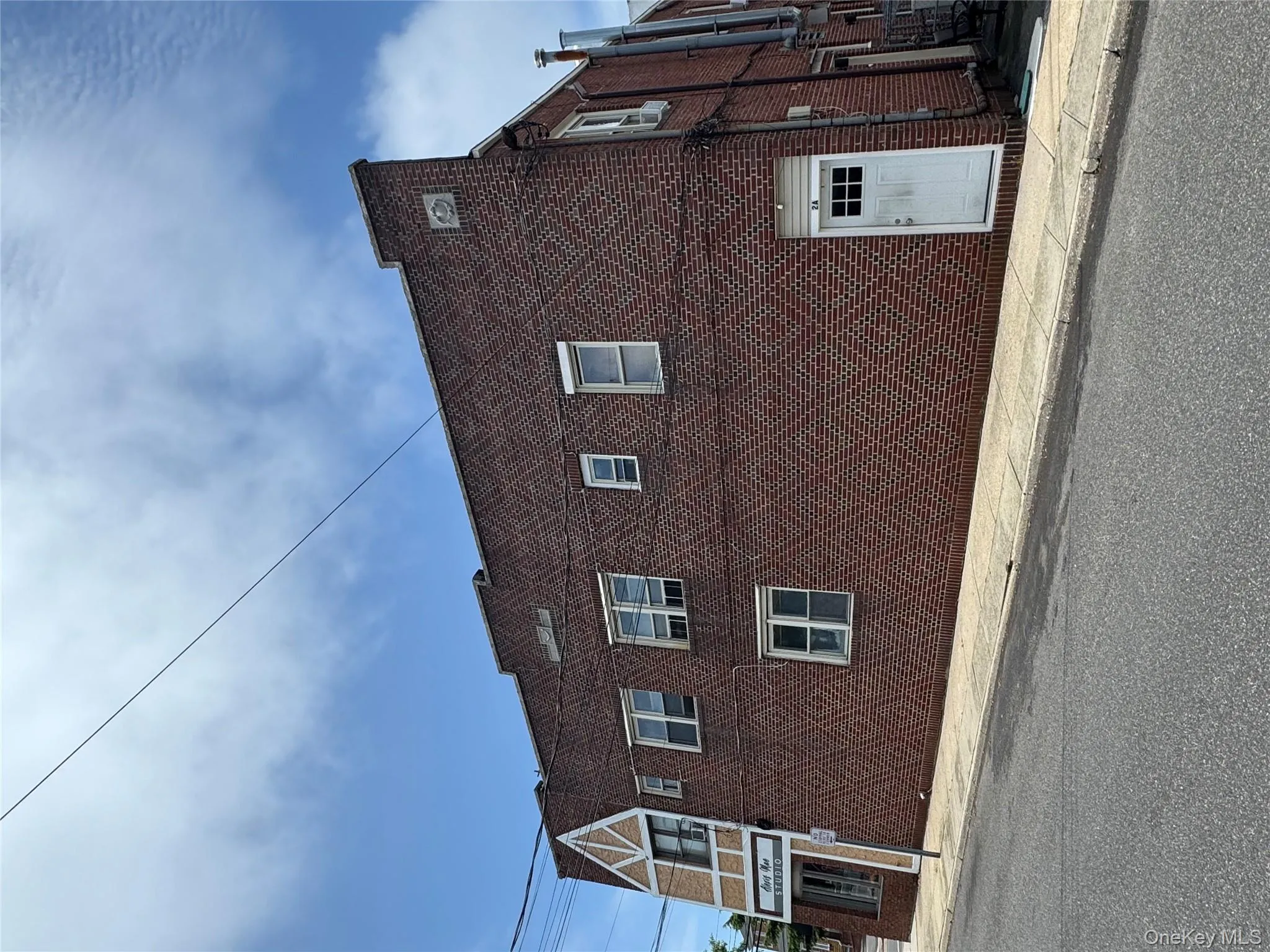 View of home\'s exterior featuring brick siding View of home\'s exterior featuring brick siding