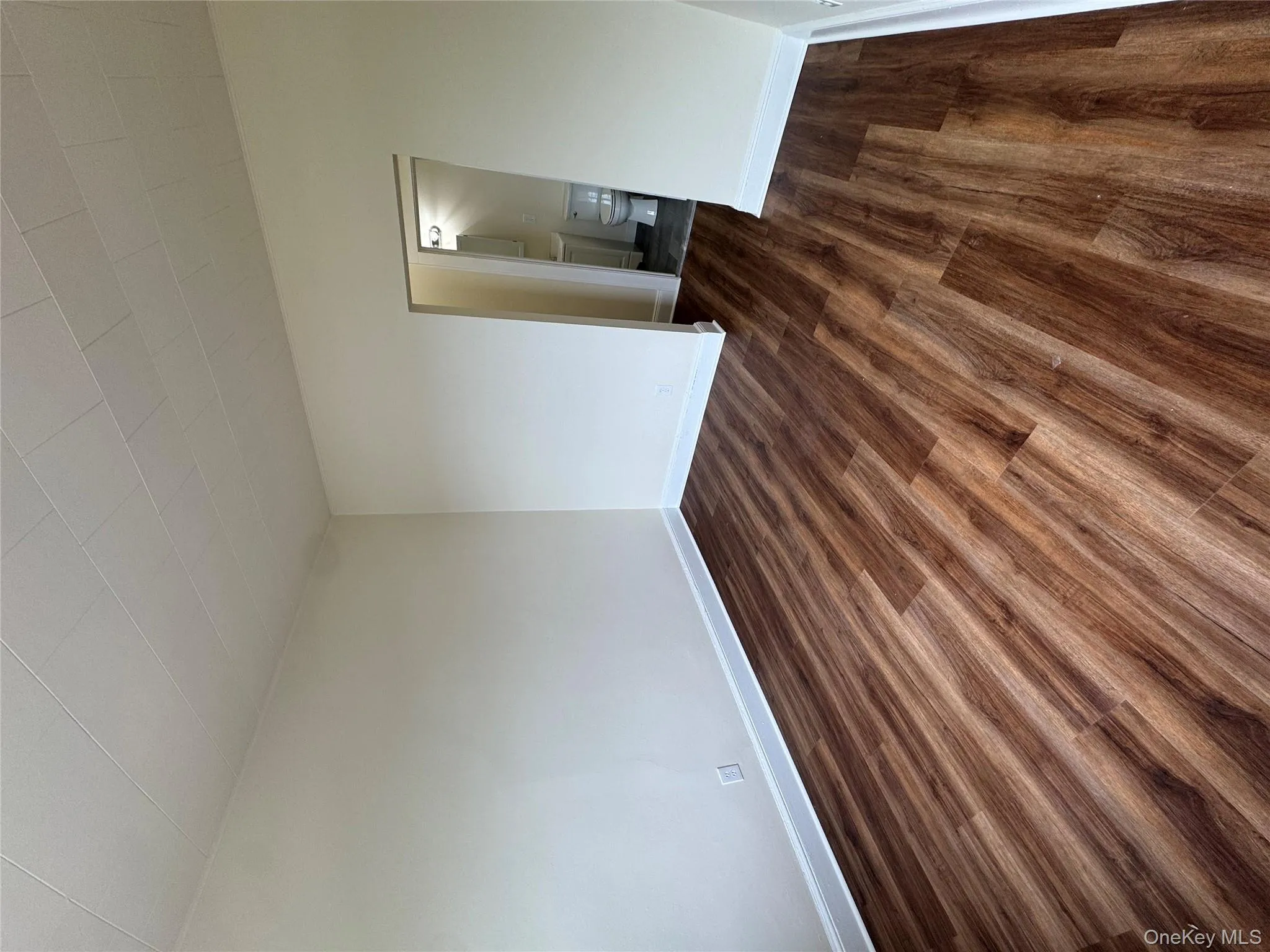 Empty room featuring dark wood-style flooring Empty room featuring dark wood-style flooring