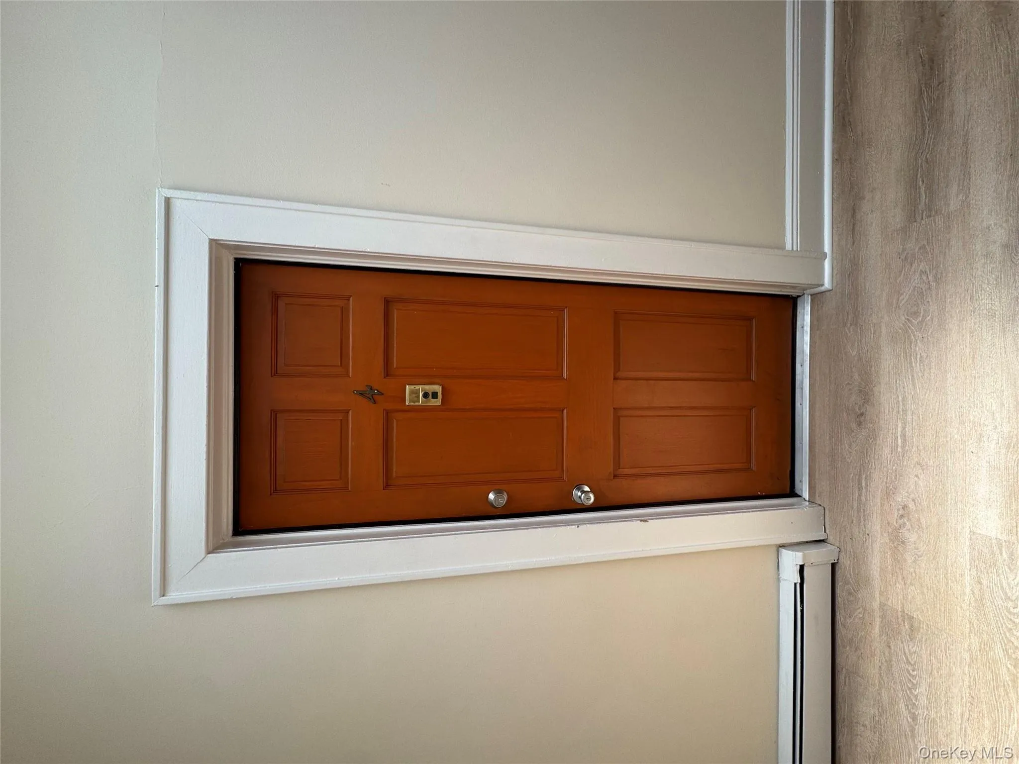 Doorway to property with a baseboard radiator Doorway to property with a baseboard radiator