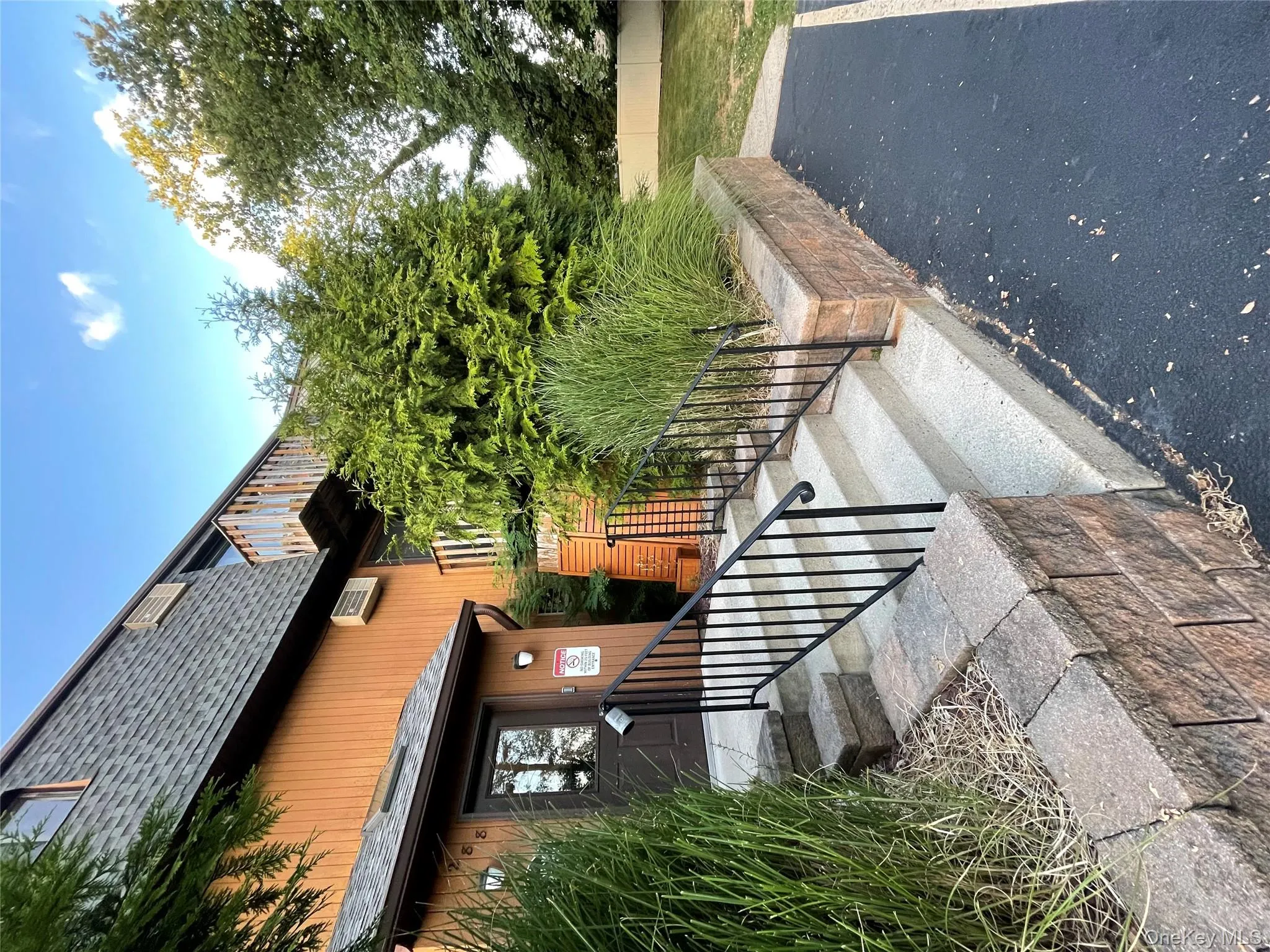 Doorway to property featuring a shingled roof Doorway to property featuring a shingled roof