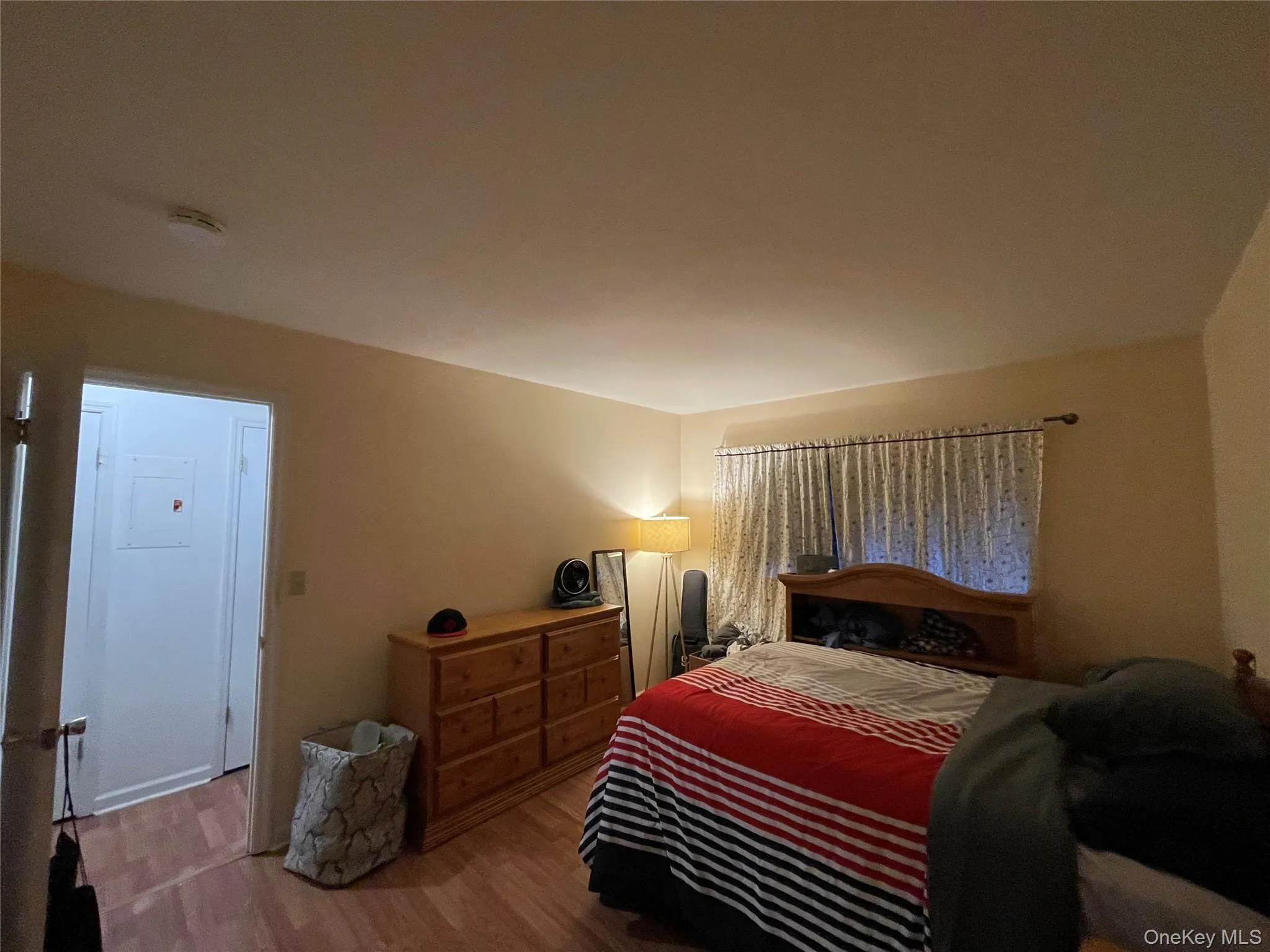 Bedroom featuring wood finished floors Bedroom featuring wood finished floors