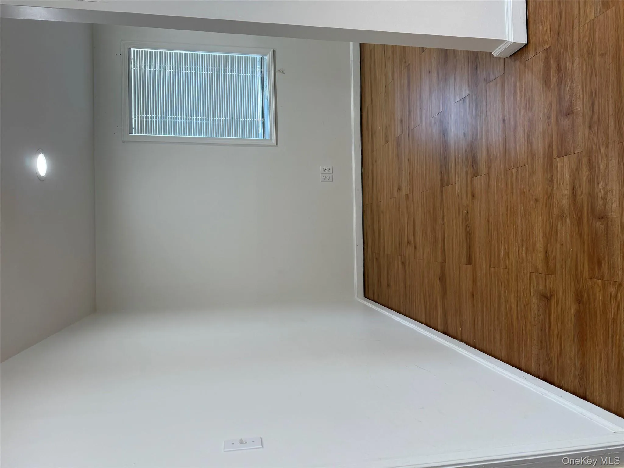 Unfurnished room featuring wood finished floors and recessed lighting Unfurnished room featuring wood finished floors and recessed lighting