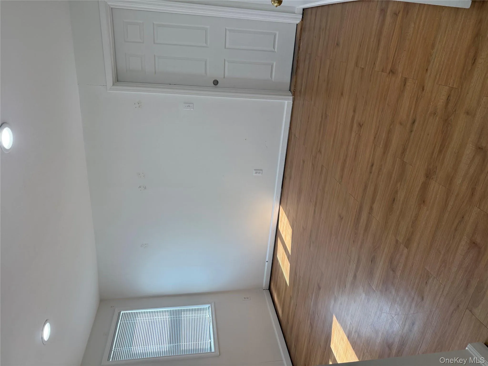 Spare room with wood finished floors and recessed lighting Spare room with wood finished floors and recessed lighting