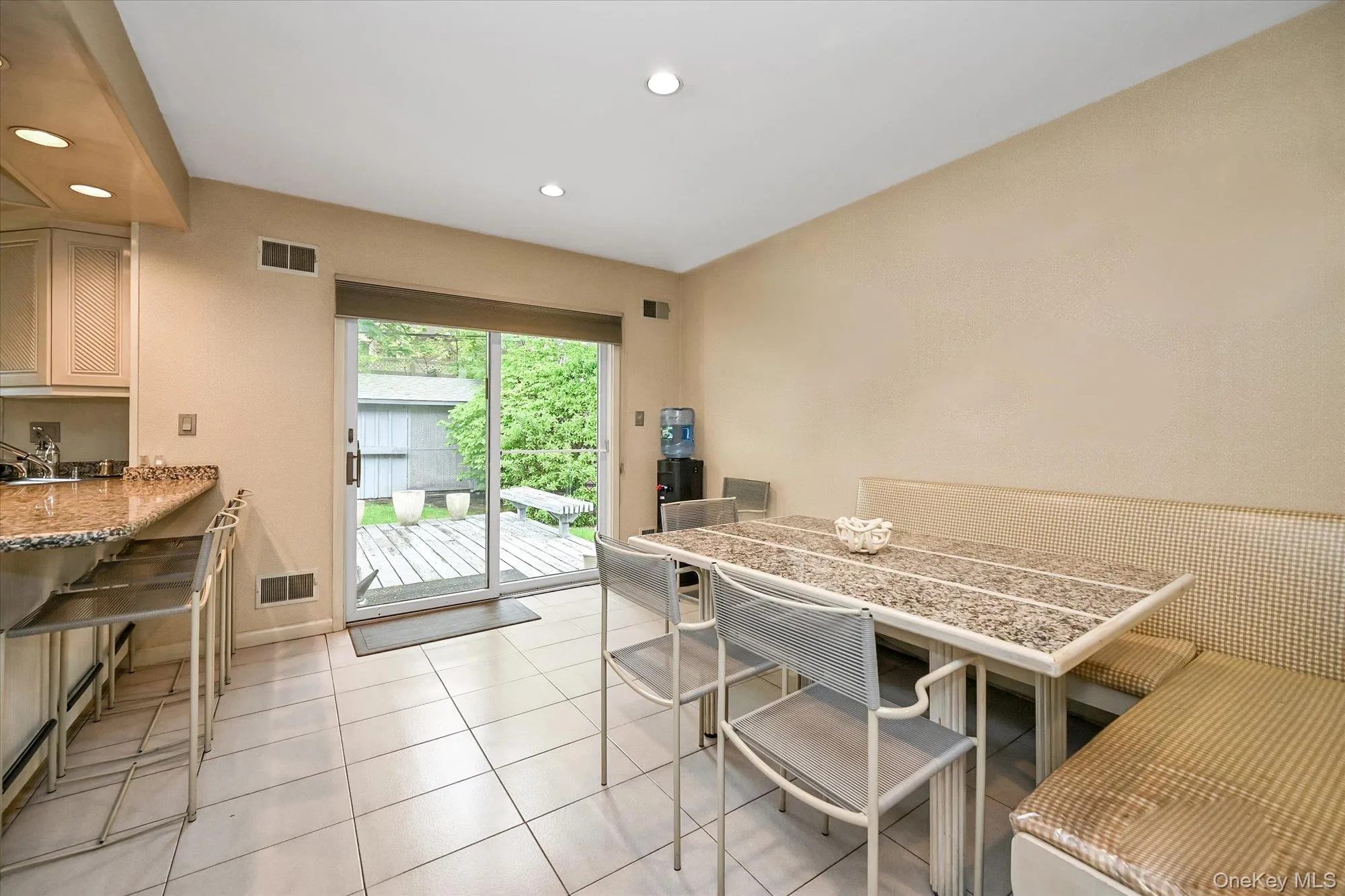 Dining space featuring recessed lighting and light tile patterned flooring Dining space featuring recessed lighting and light tile patterned flooring