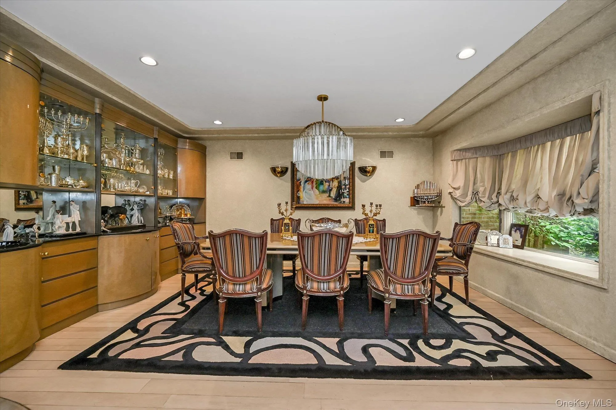 Dining room featuring light wood-style floors and recessed lighting Dining room featuring light wood-style floors and recessed lighting
