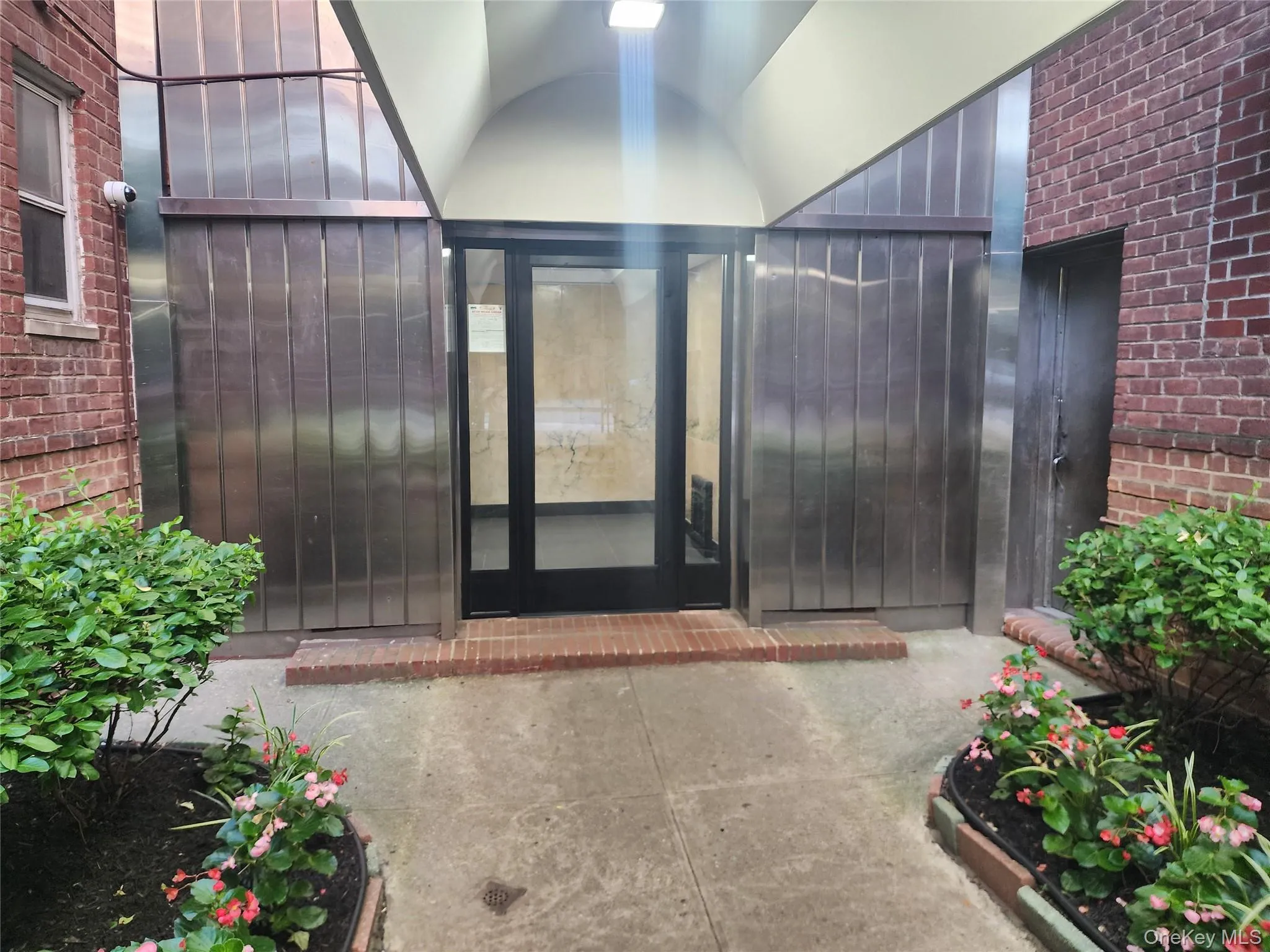 Doorway to property with brick siding Doorway to property with brick siding