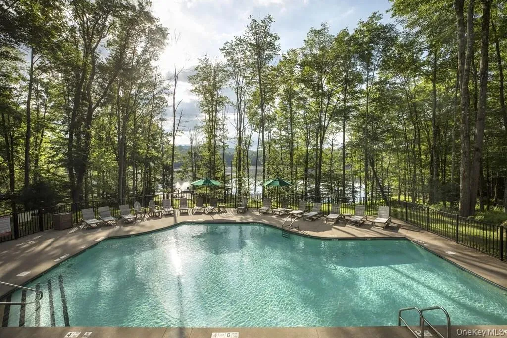 Community pool with a patio Community pool with a patio