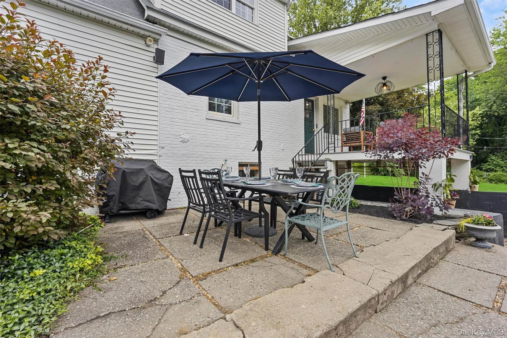 View of patio / terrace with area for grilling and outdoor dining space View of patio / terrace with area for grilling and outdoor dining space